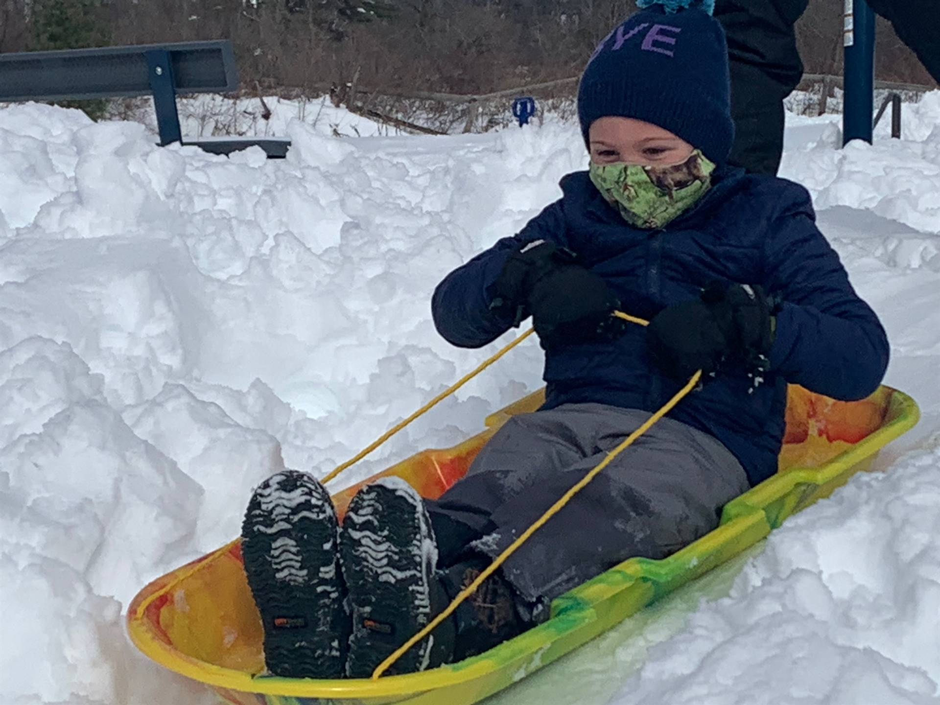 a student is Sledding.
