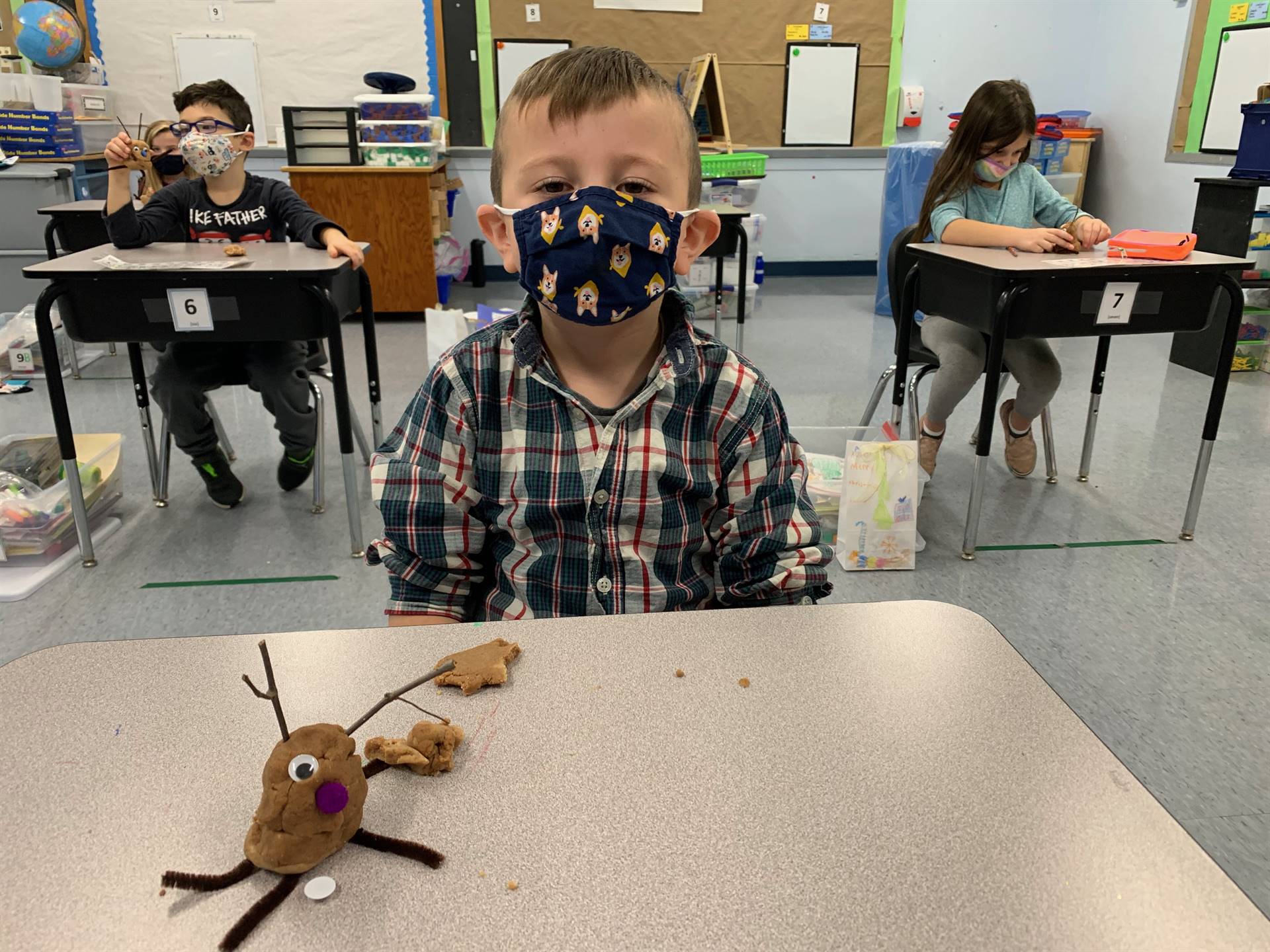 student shows playdo reindeer