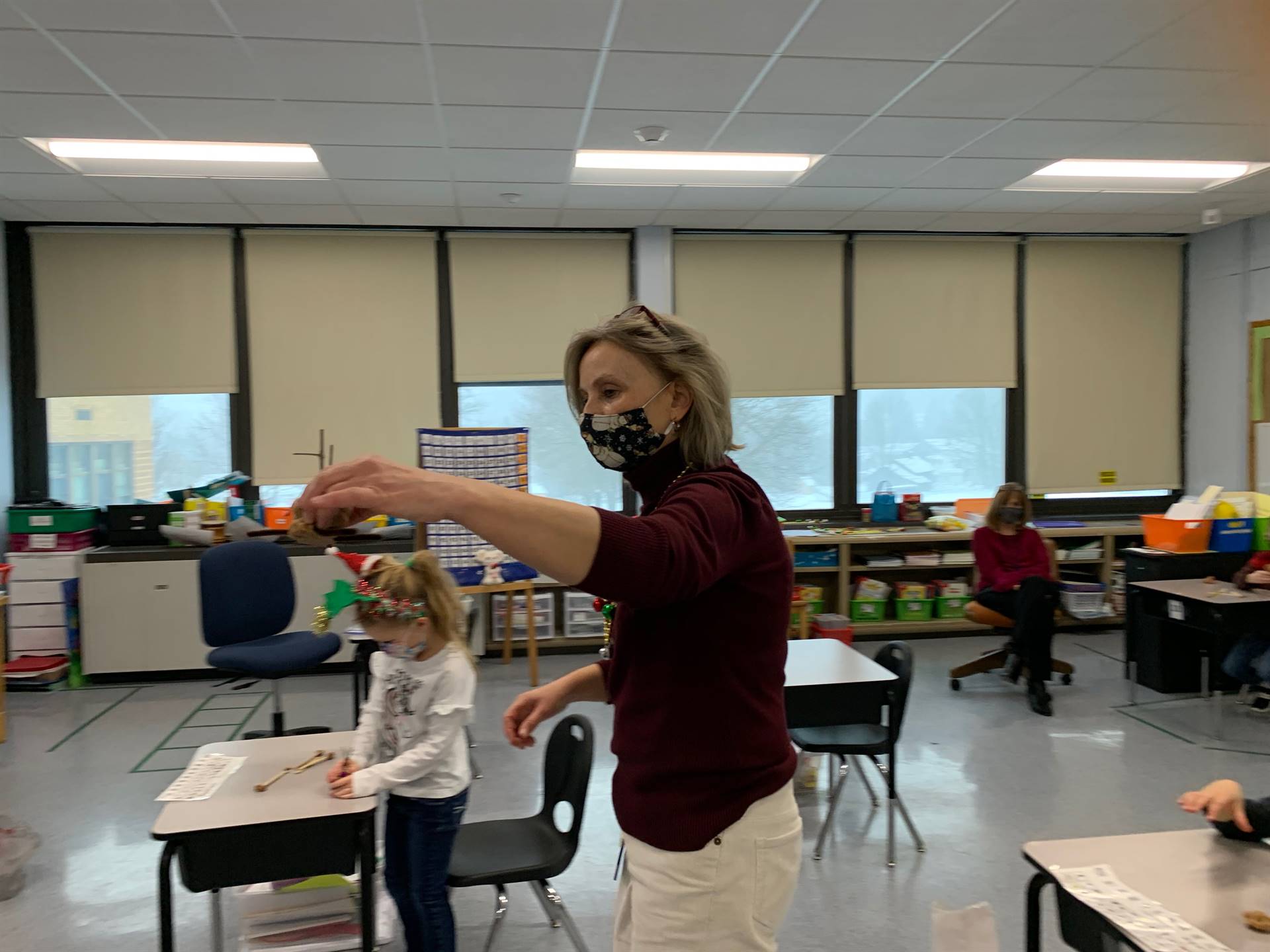 A teacher demonstrates how reindeer fly.