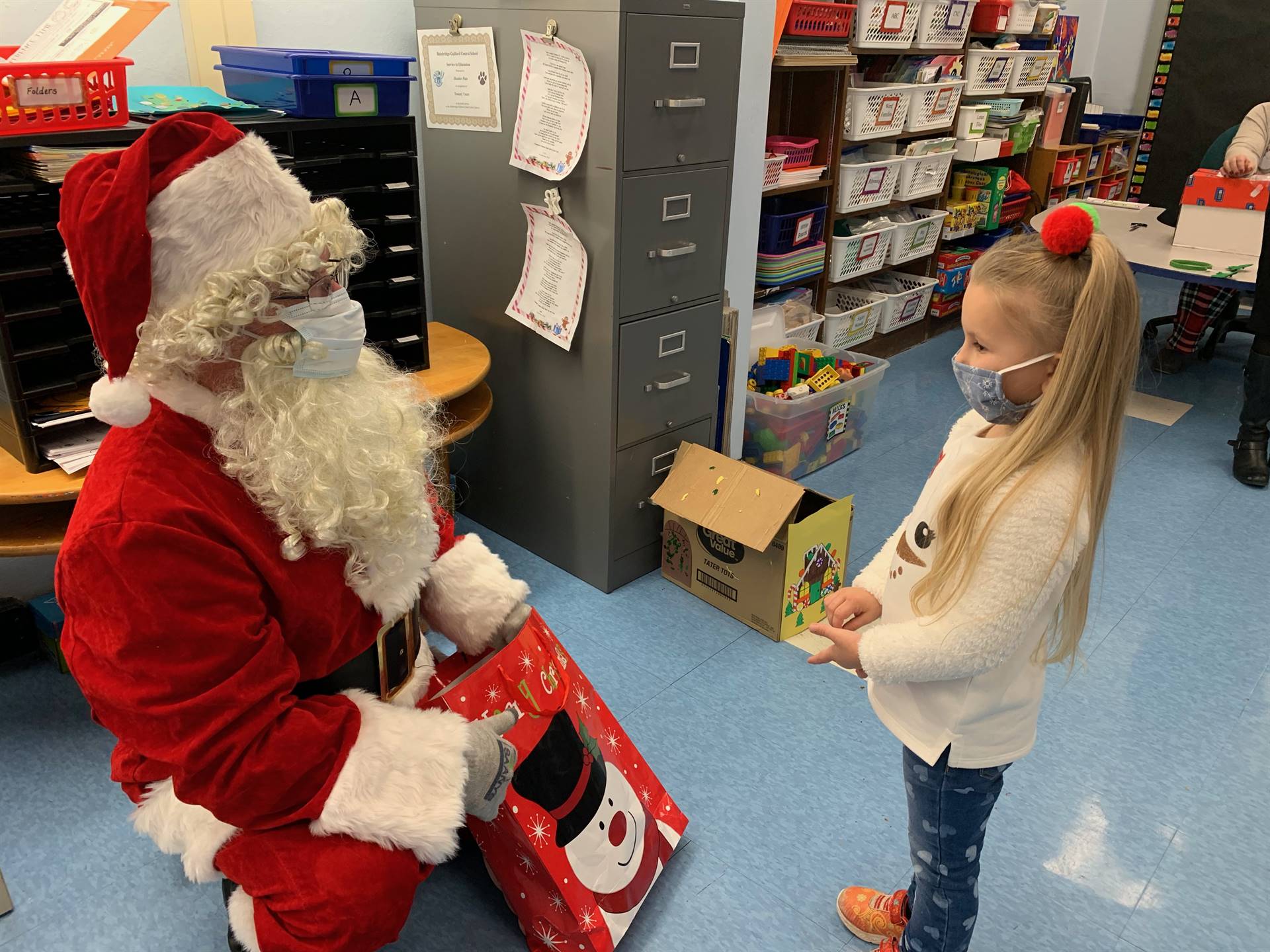 Santa talks to a student.