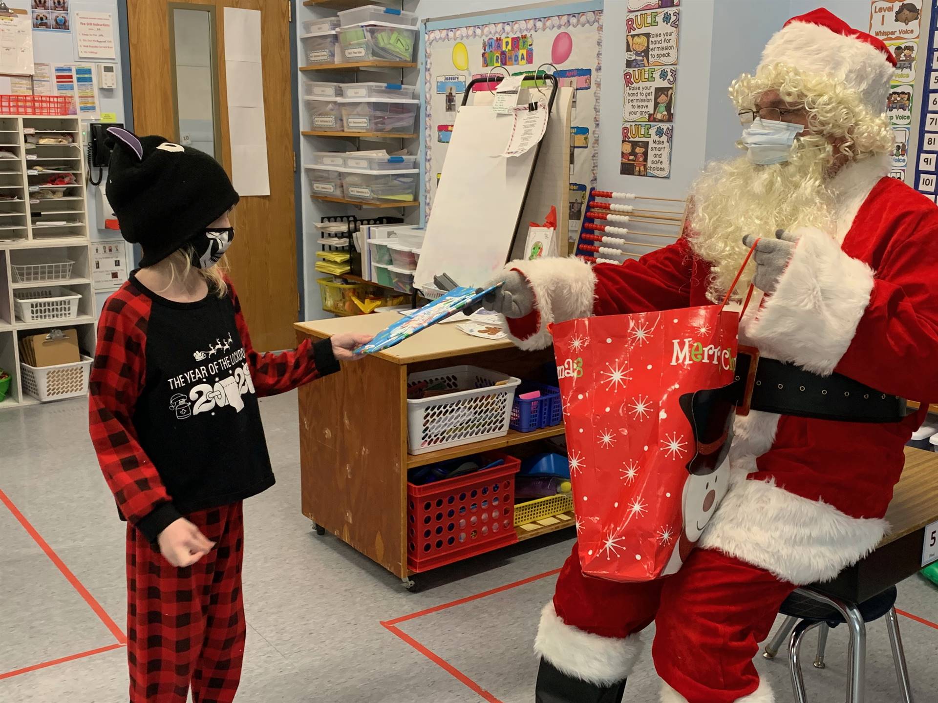 Student accepts gift from Santa