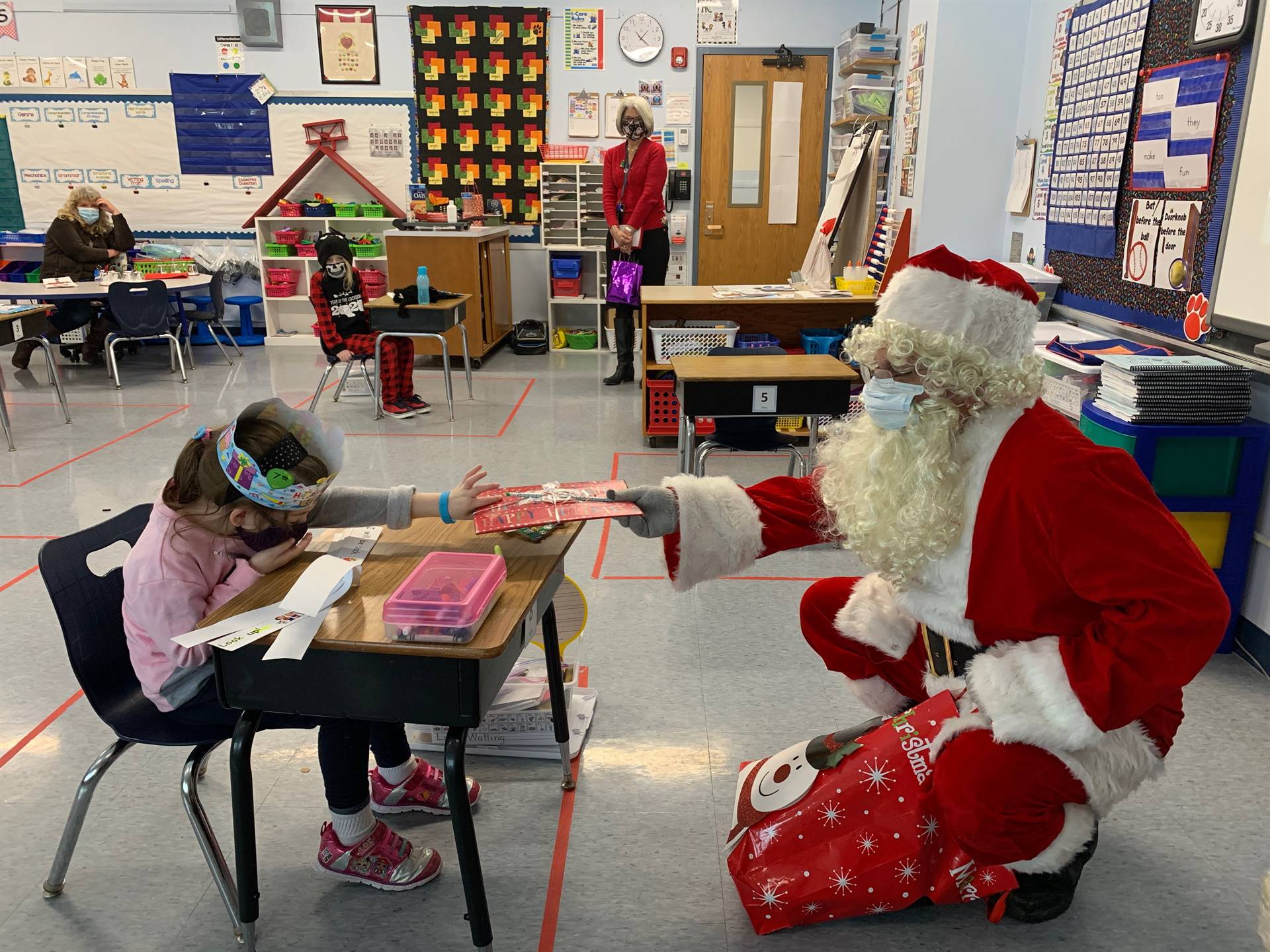 Santa hands a gift out to a birthday child!