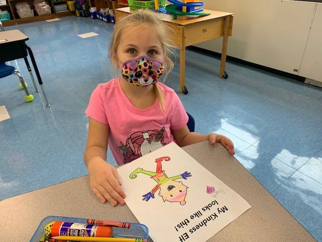Child is proud of their coloring skills!