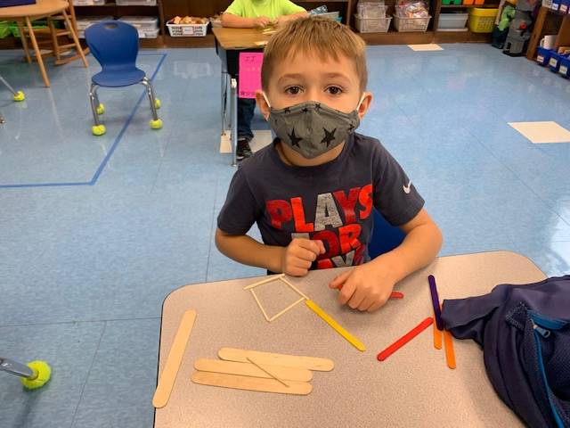 A student is building with sticks in math!