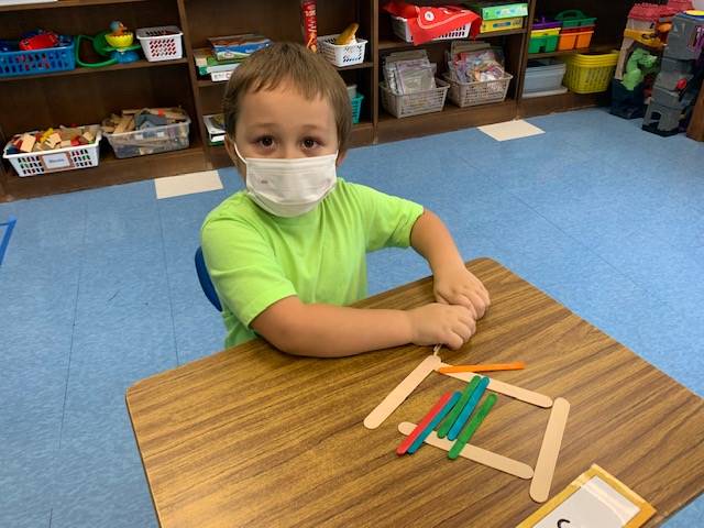 A student is building with sticks in math!
