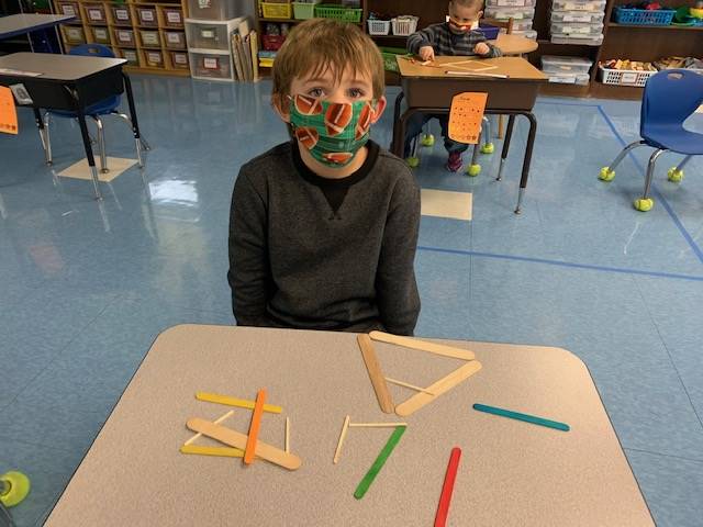 A student is building with sticks in math!