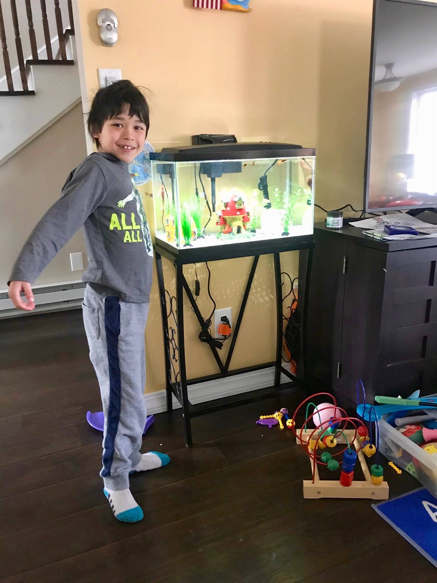 student by fish tank