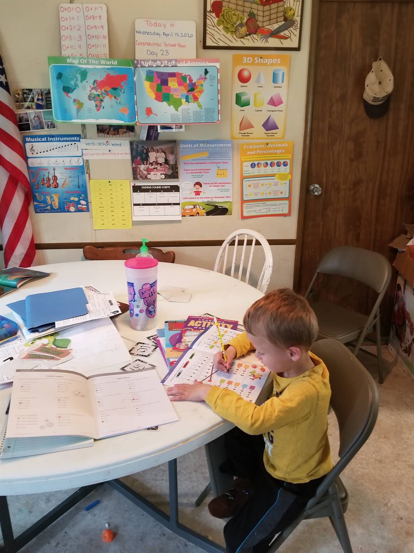 Student working at table.