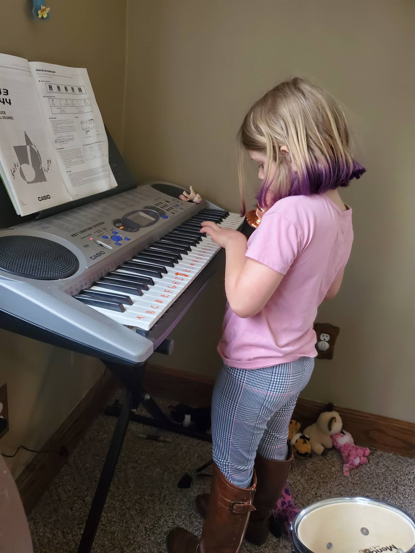 Student playing keyboard.