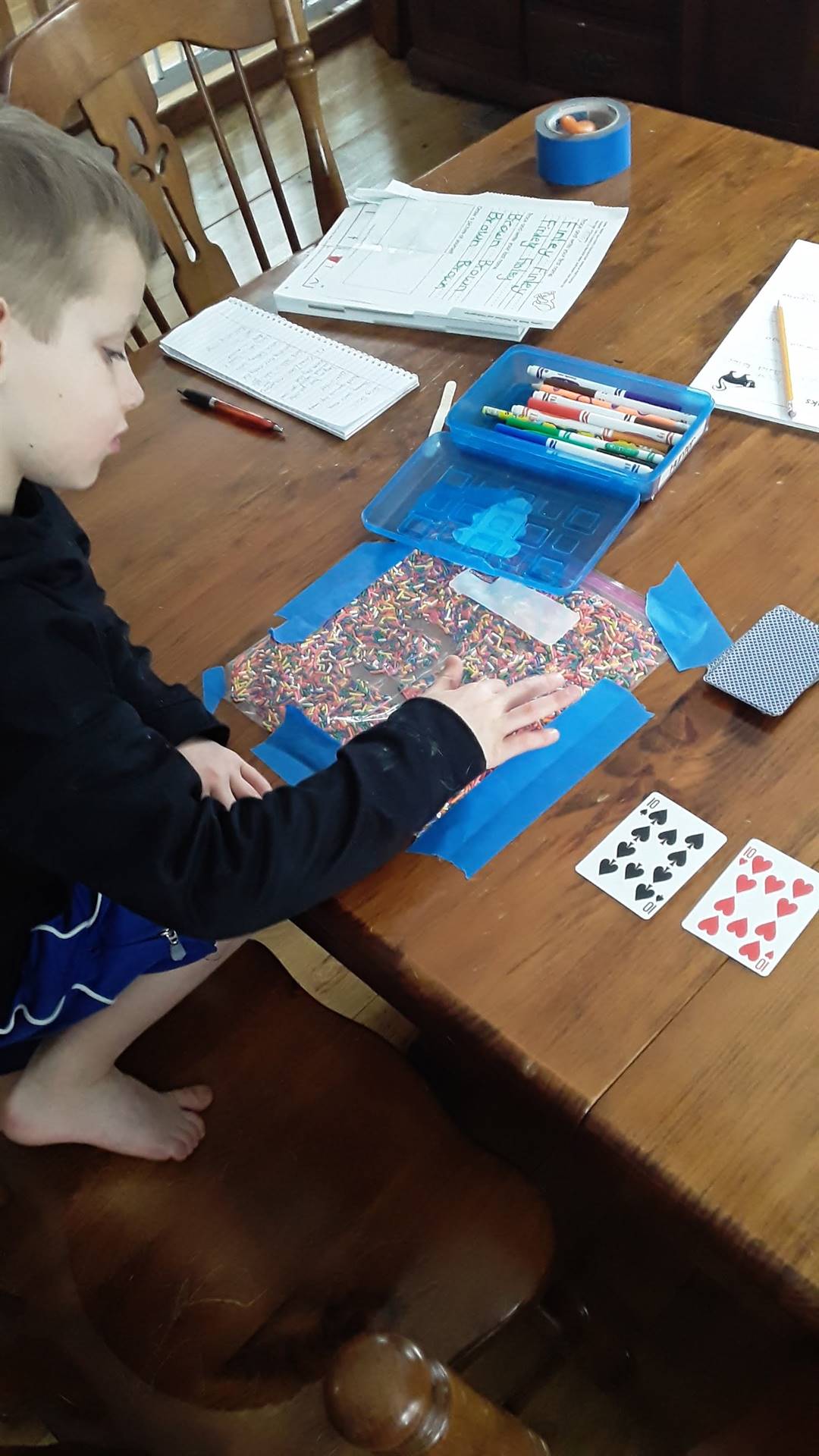 Student working at table. 