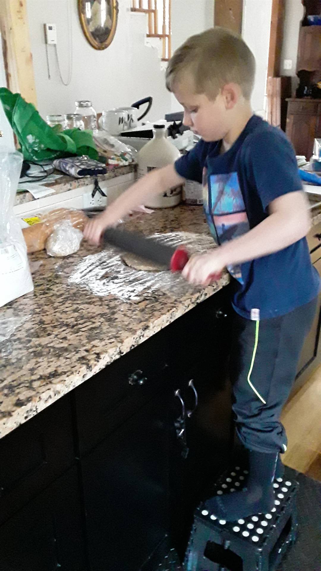 student rolling dough.