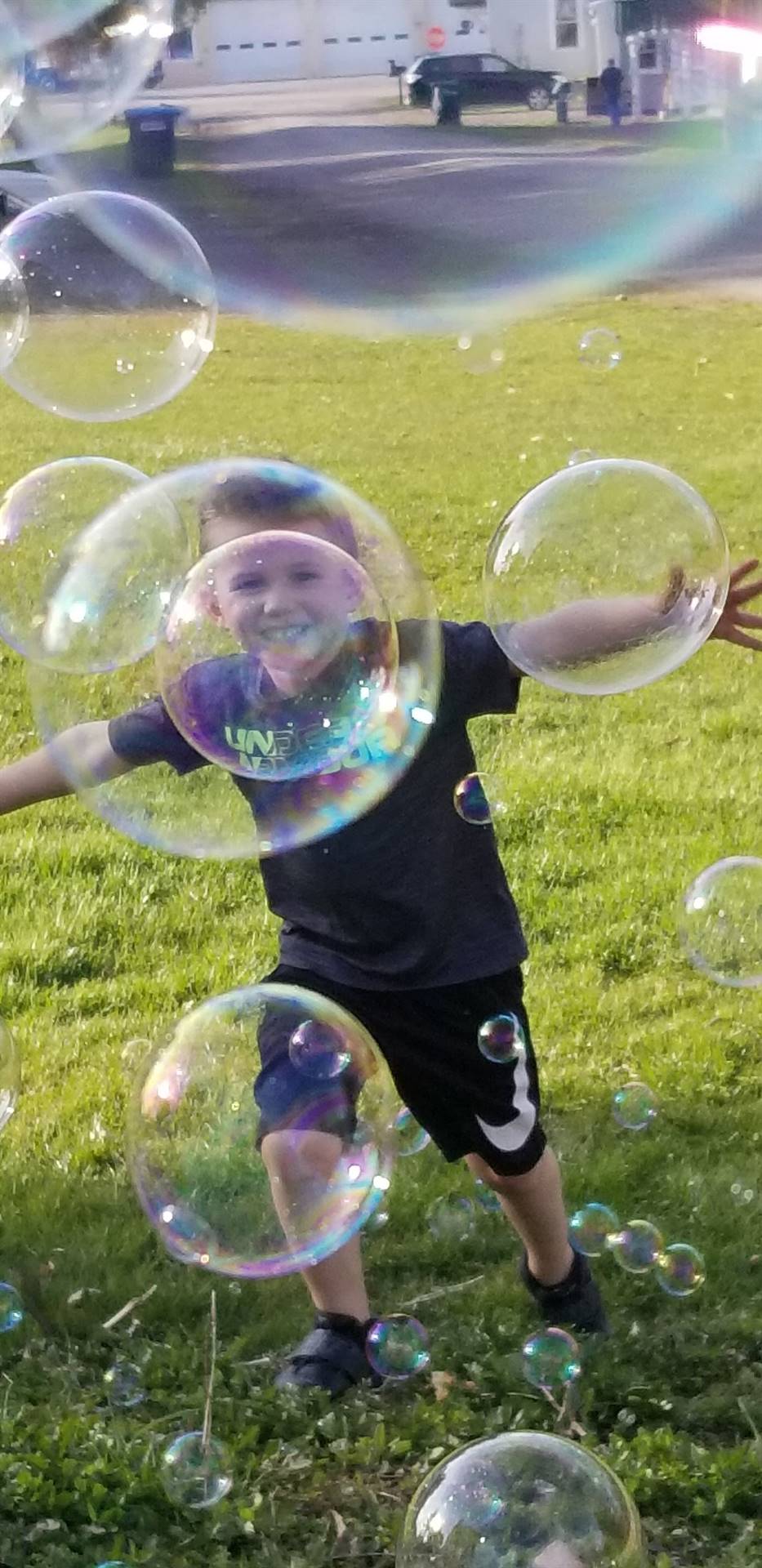 A child playing with bubbles.