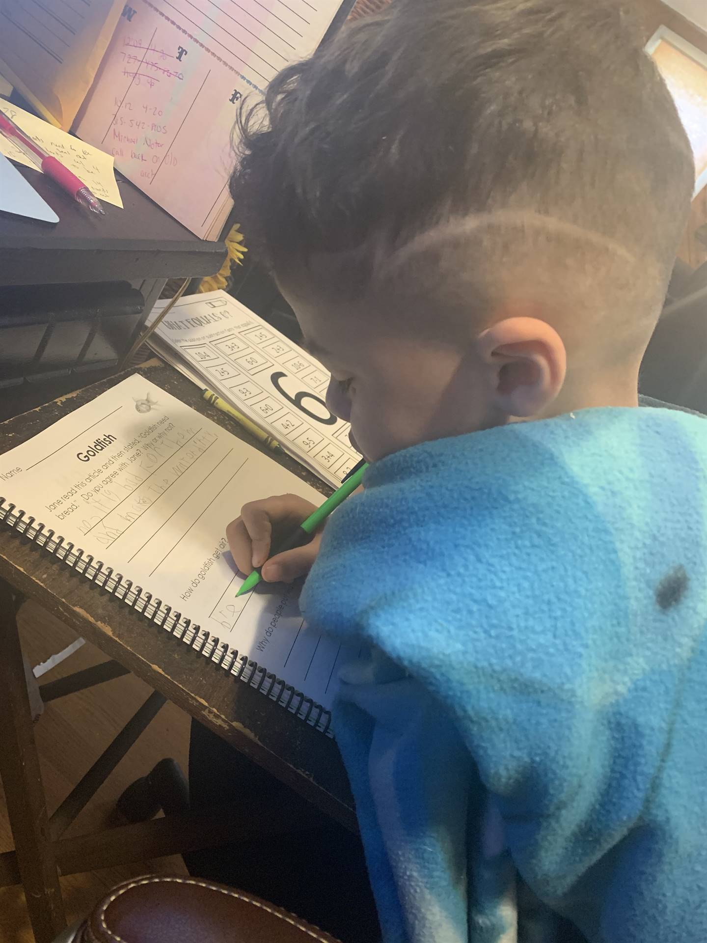 A boy is writing.