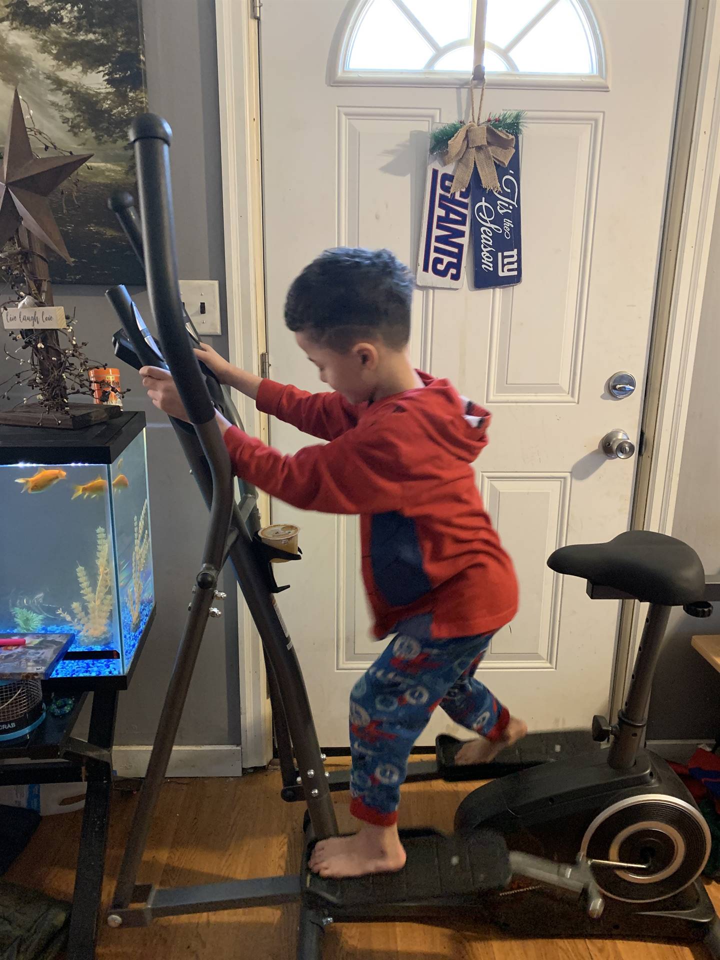 A boy on the exercize gym.