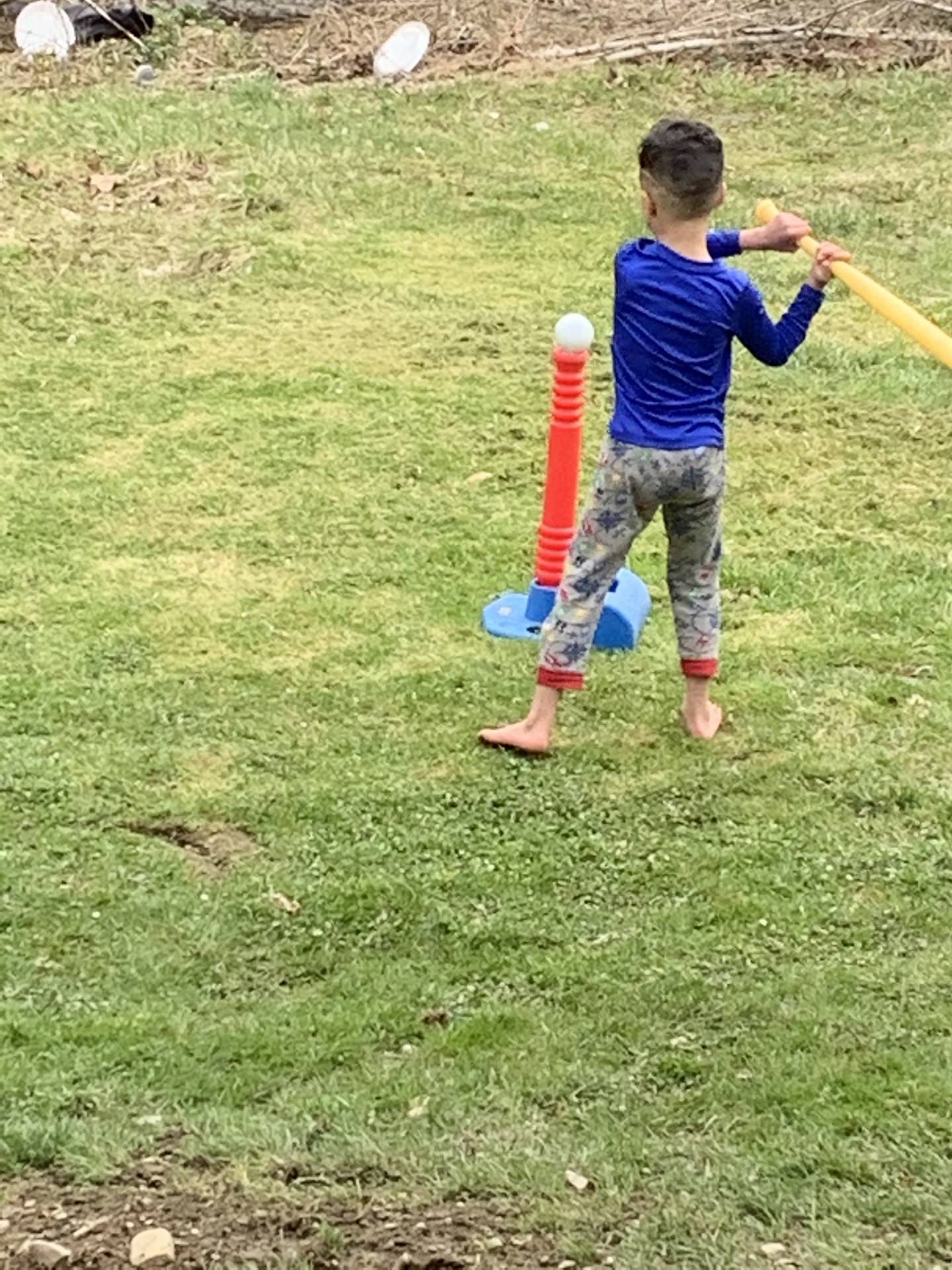 A boy swings at a ball!