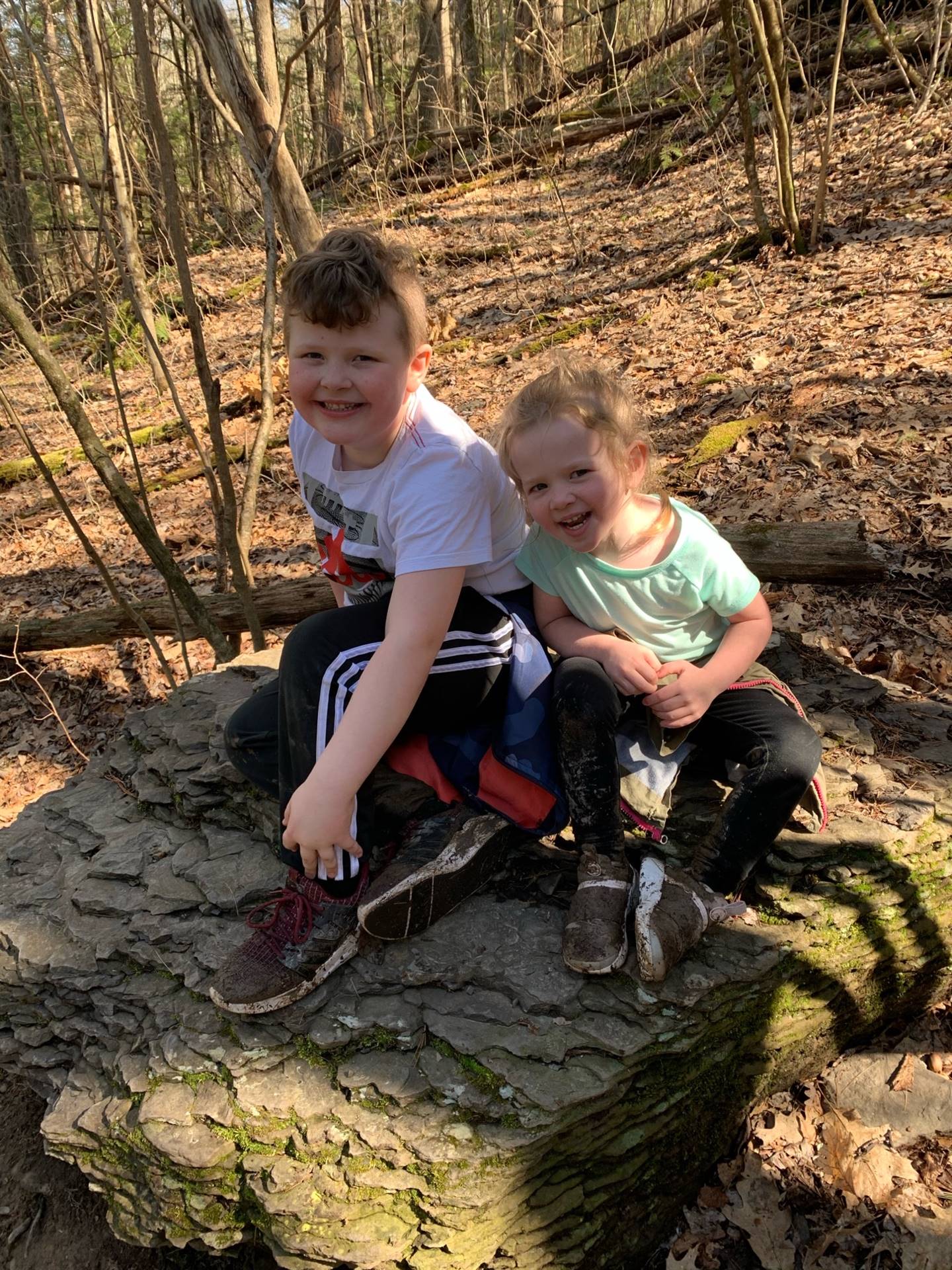 2 kids on a rock