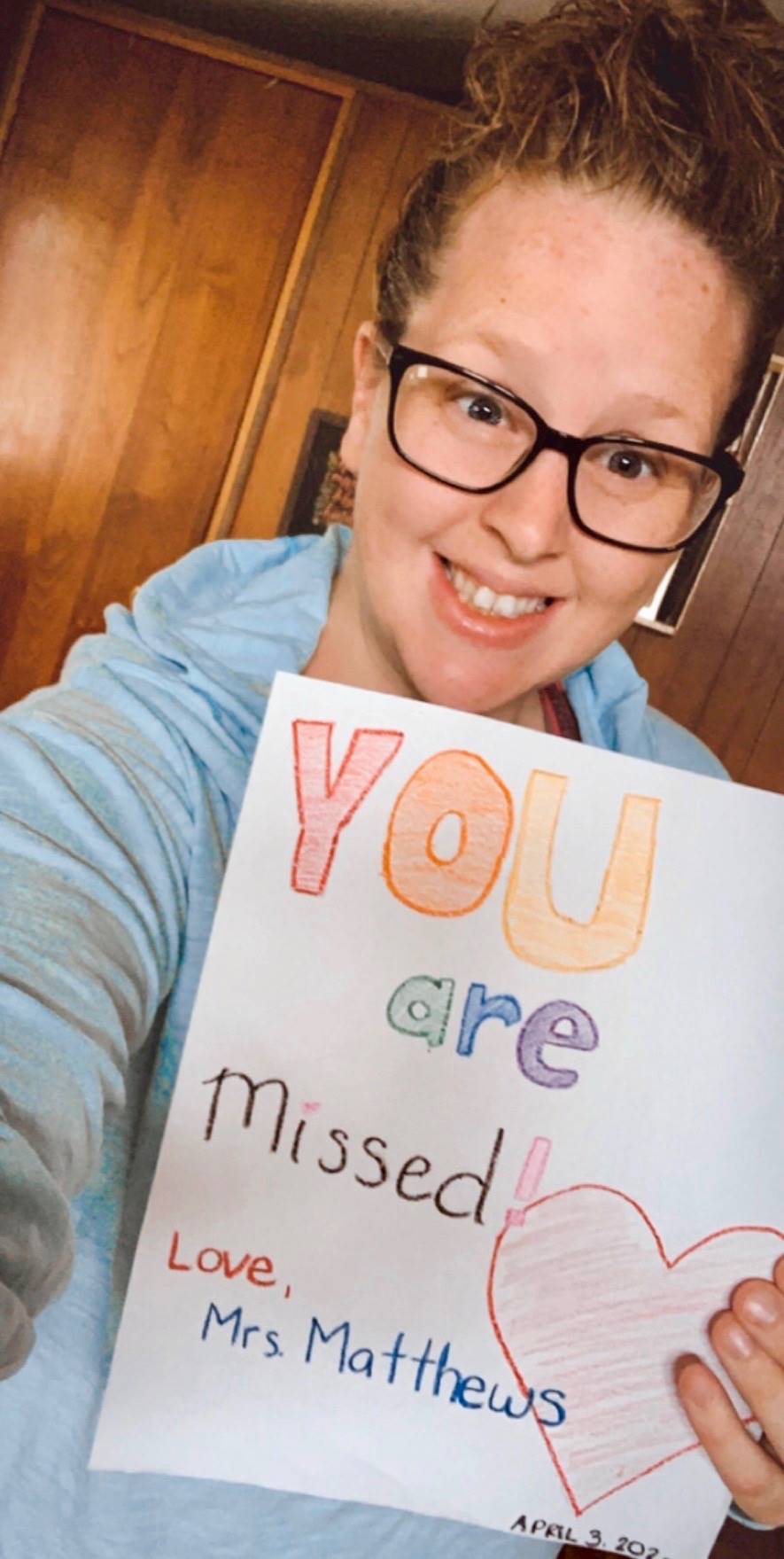 A staff member with a sign.