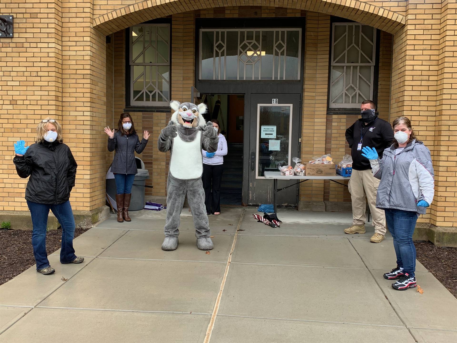 staff in front of school