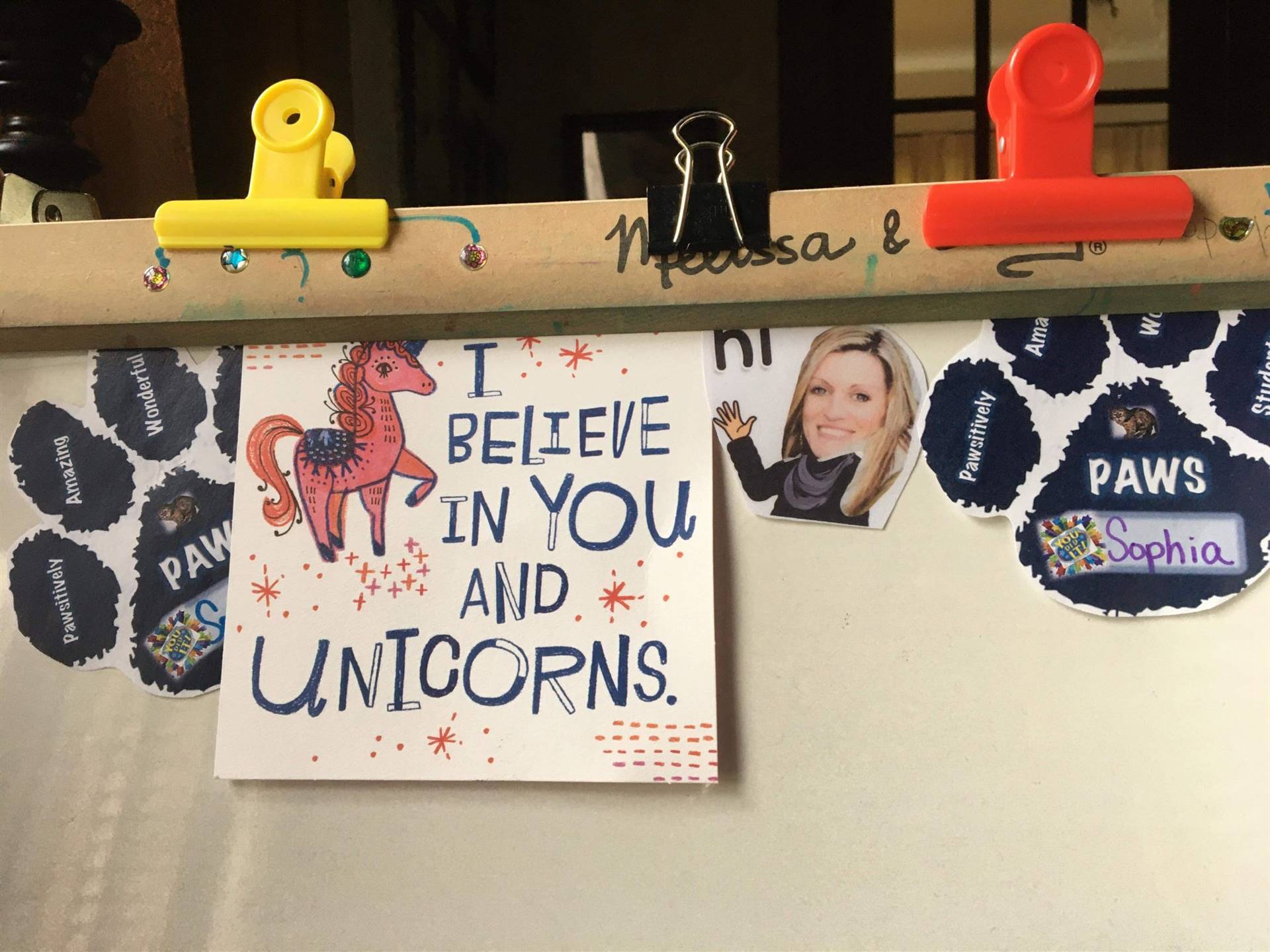 Paper face of teacher with "I believe in you and unicorns."