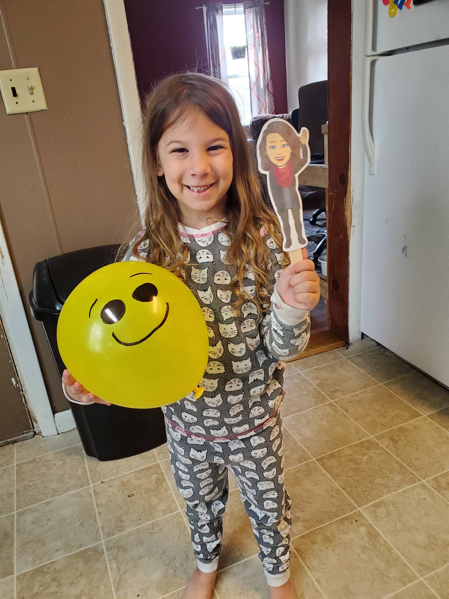 student with balloon and her paper doll teacher!