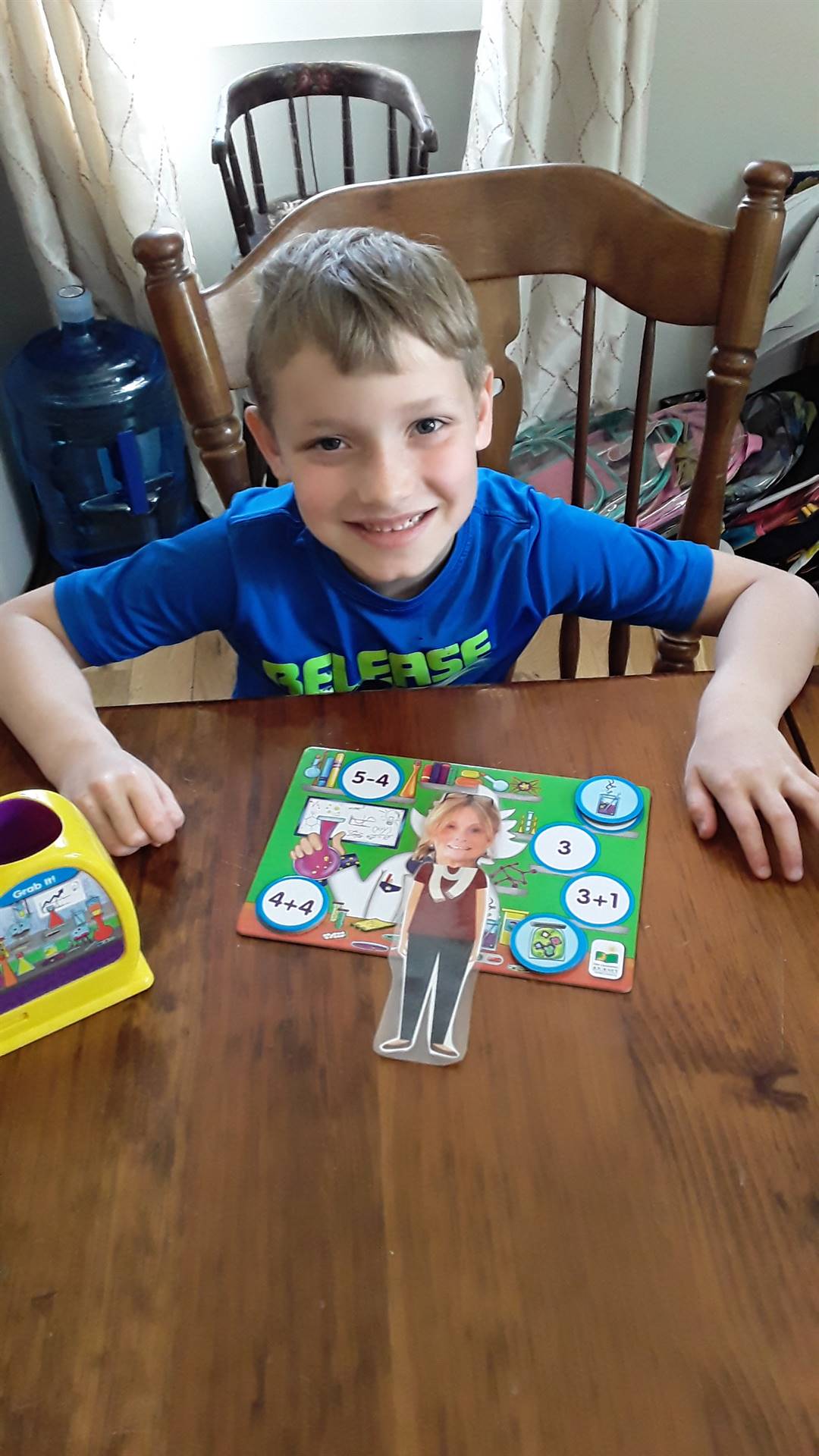 student playing a game with his paper doll teacher!
