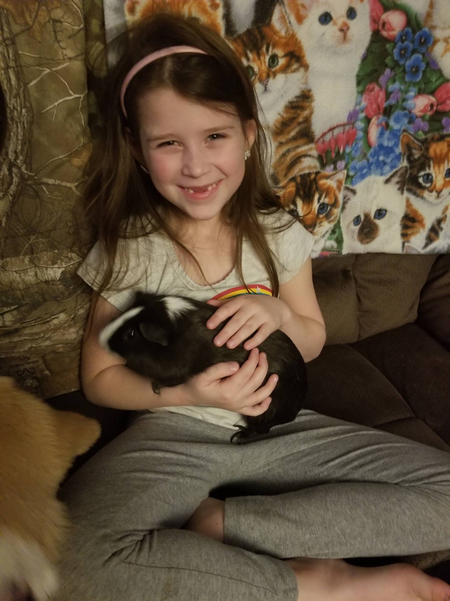 A student with pet guinea pig.