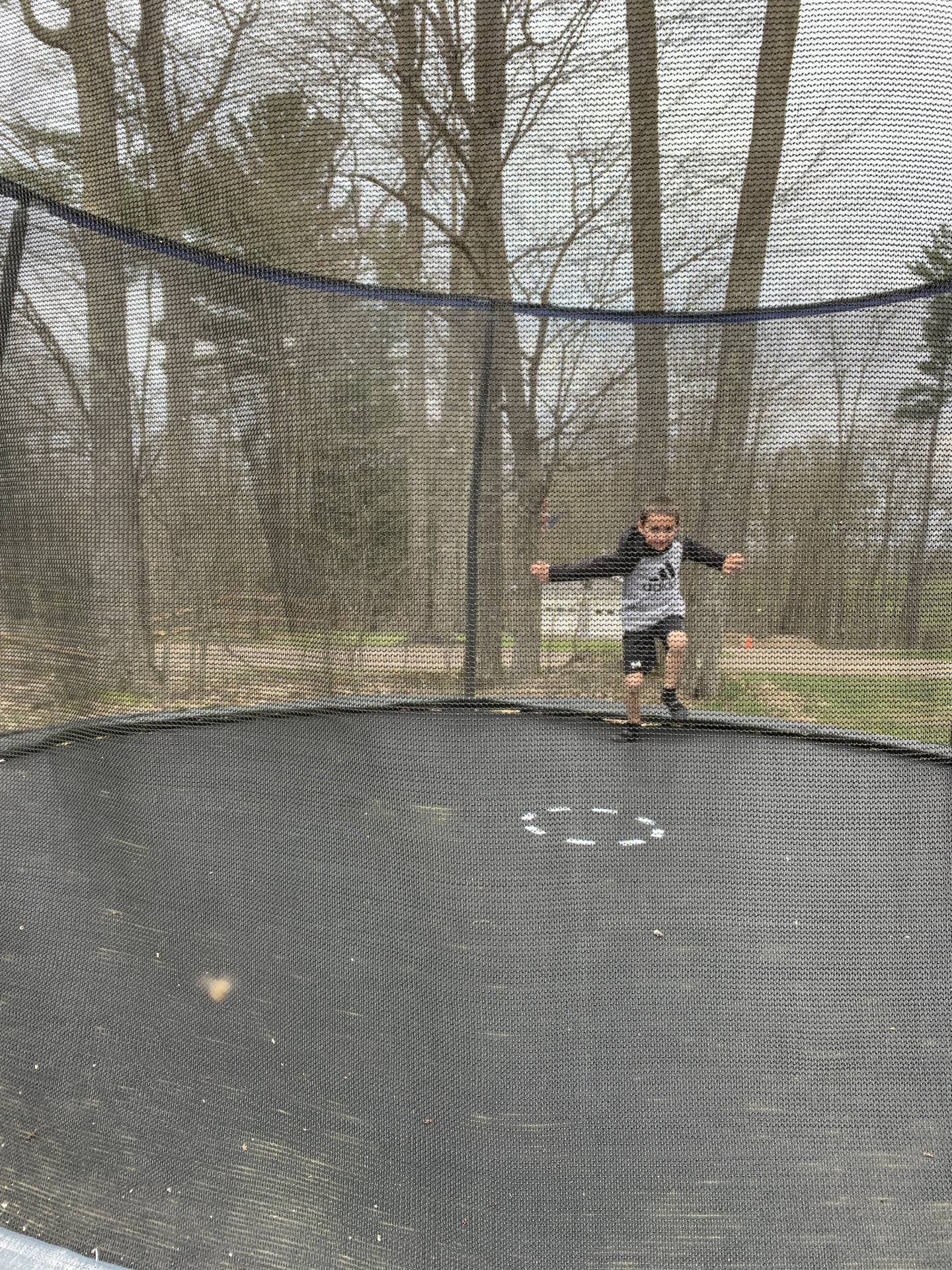 student on trampoline