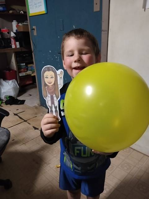 student with paper doll teacher and balloon.