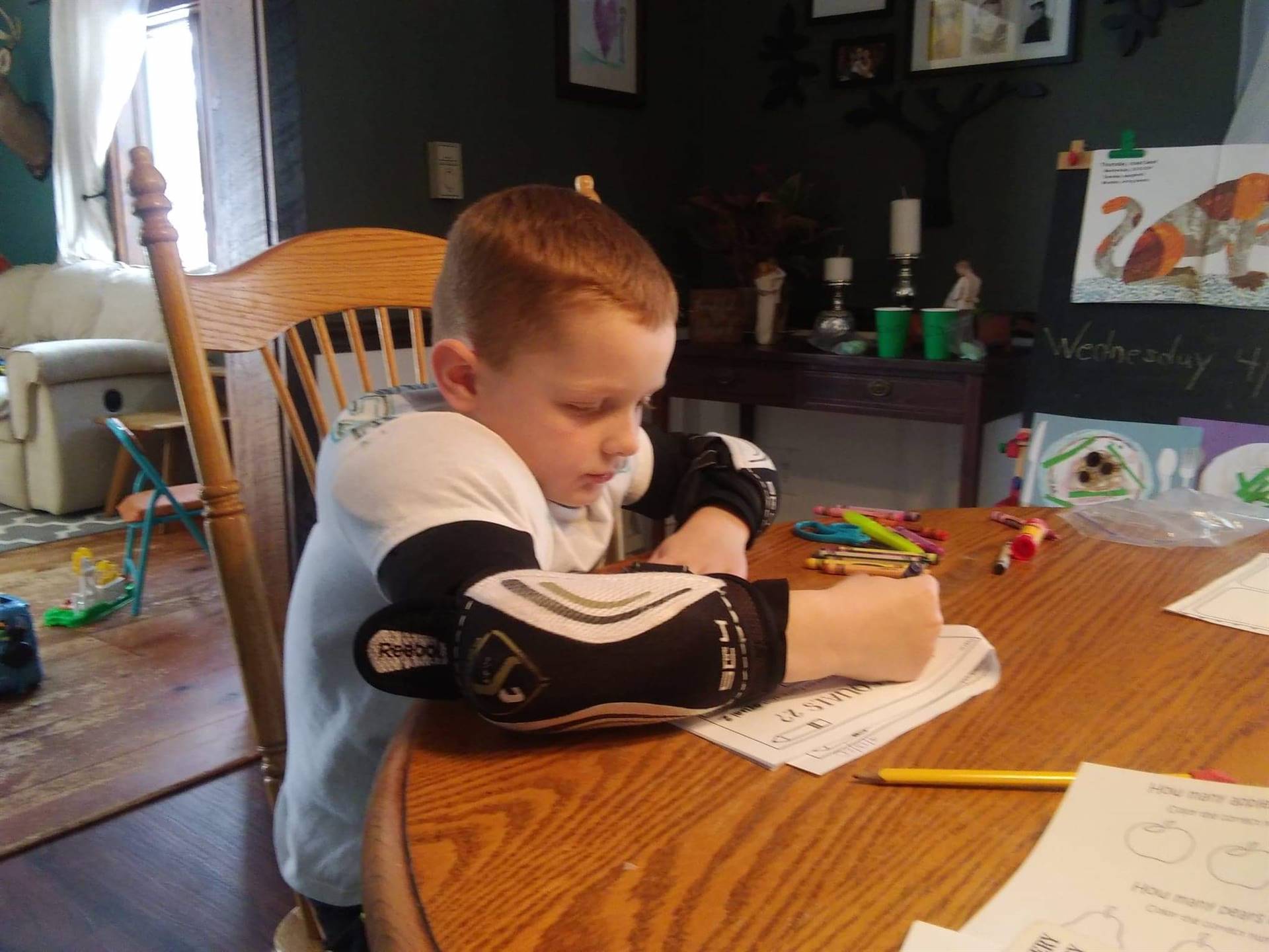 Student working in hockey uniform