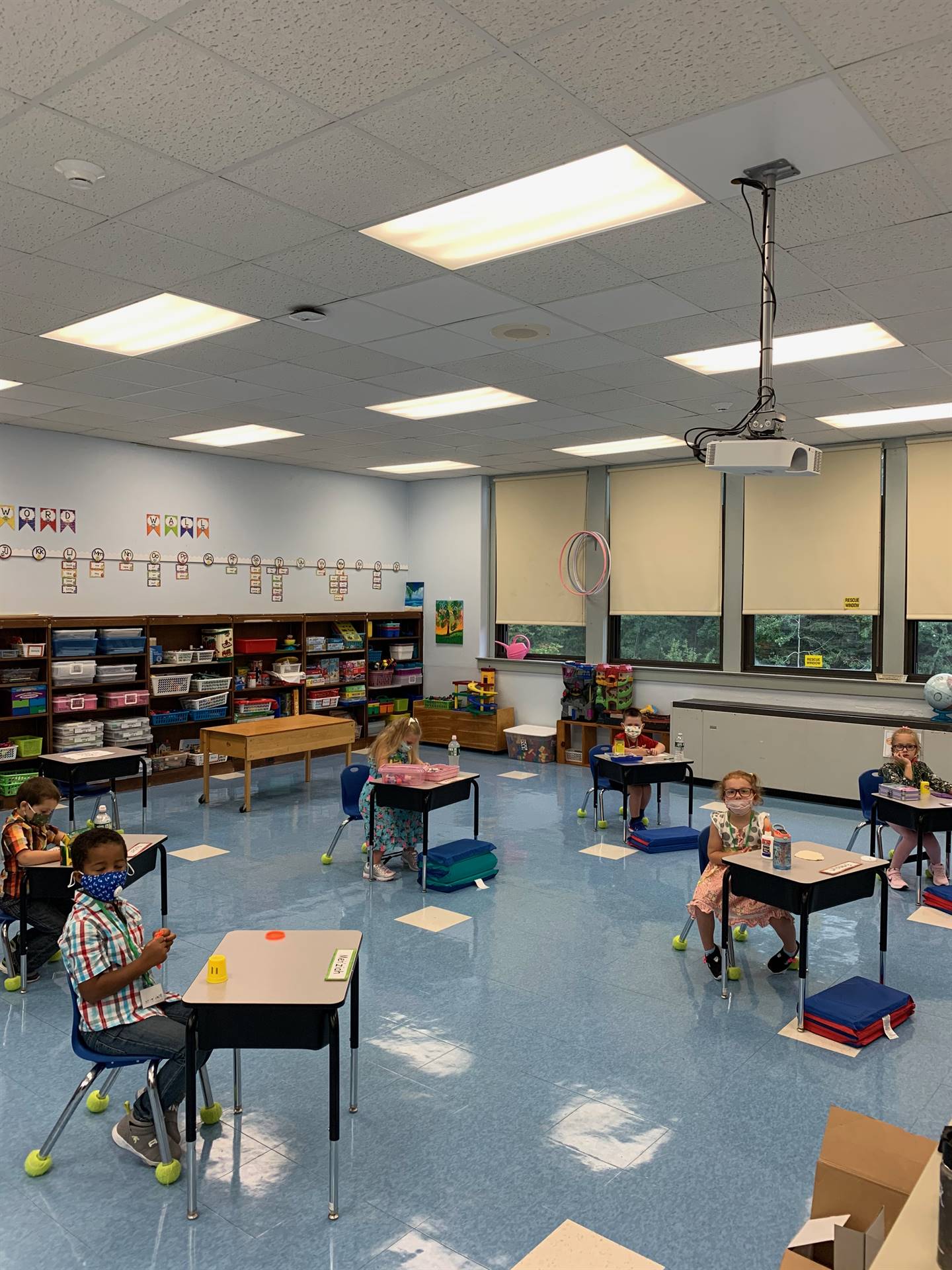 students in classroom sitting at desks.