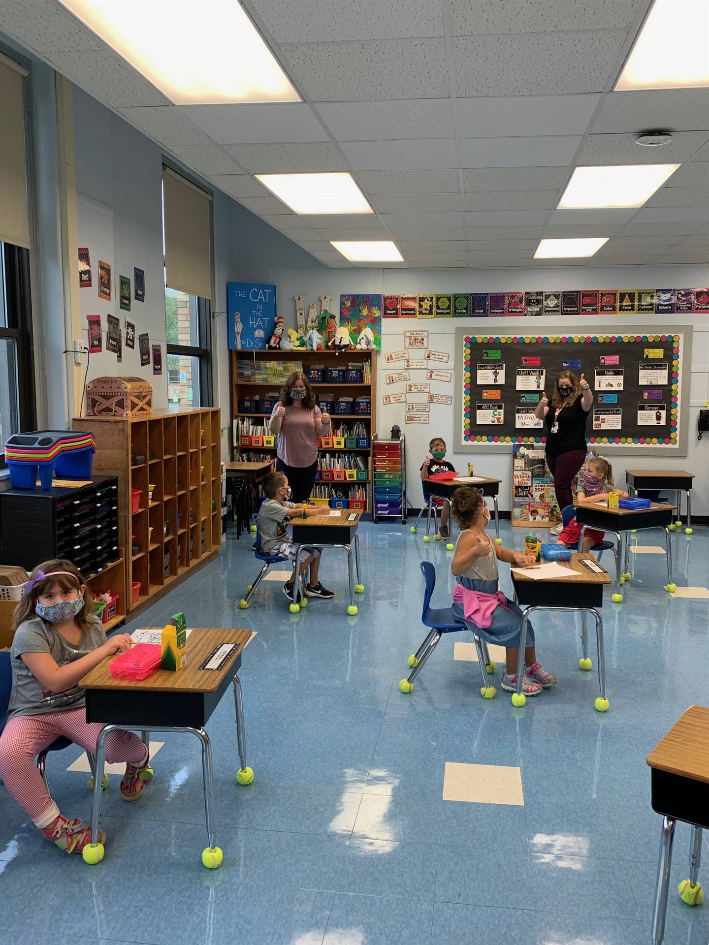 students in classroom sitting at desks.