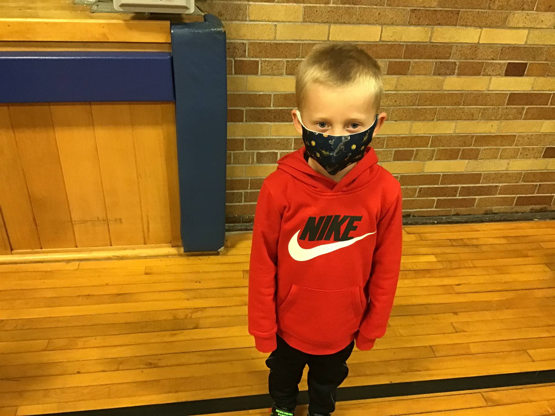 A student shows safe mask wearing