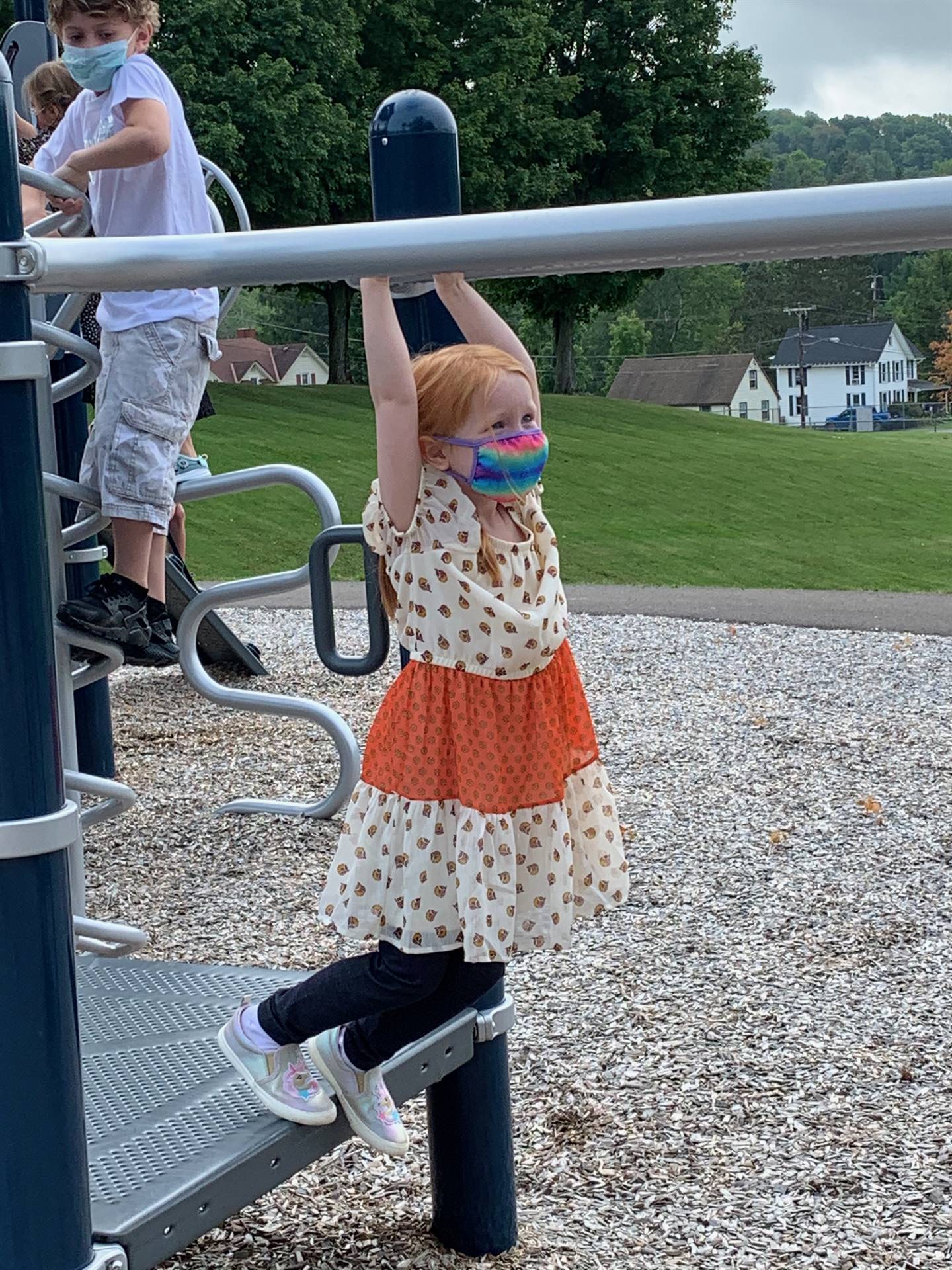 student hanging on monkey bars!