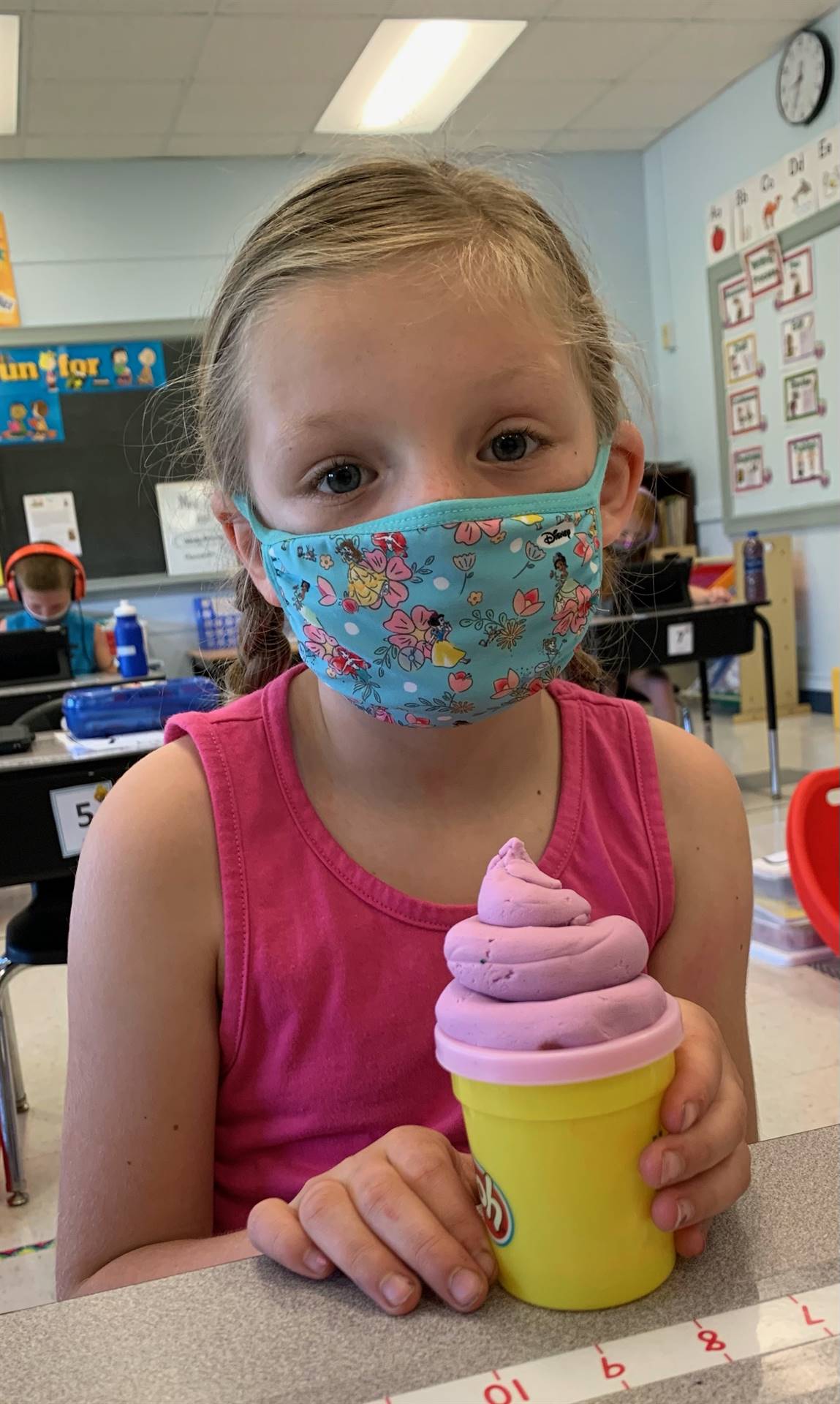 Child with playdo ice-cream cone.