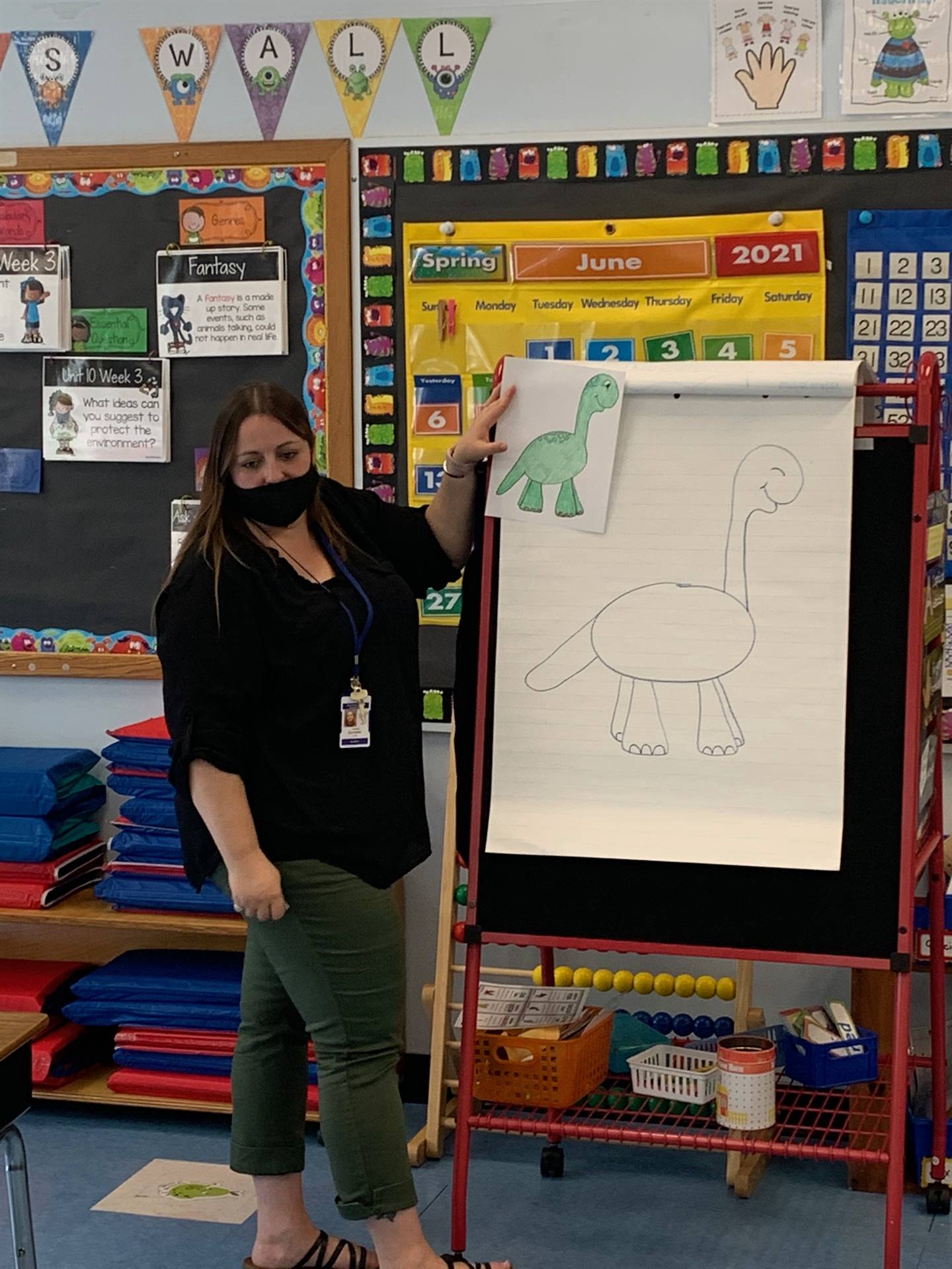 Teacher drawing dinosaur
