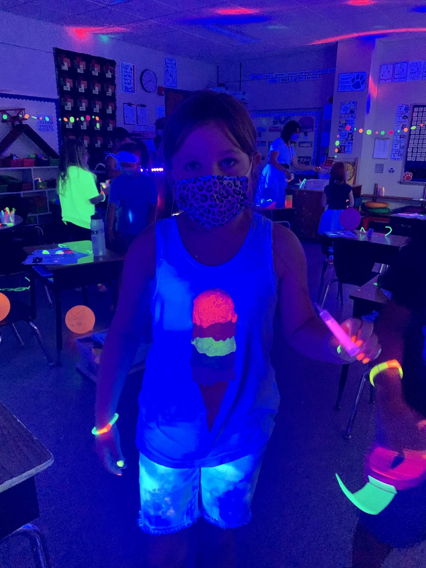 a student with and ice cream cone glow up shirt!
