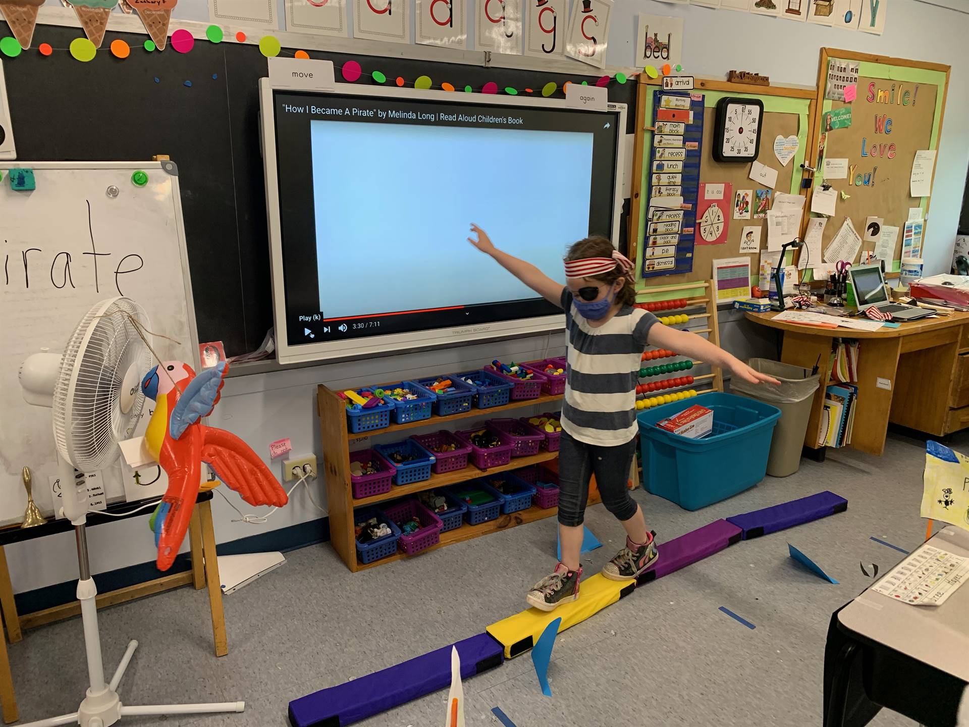 A student pirate walking the "plank".