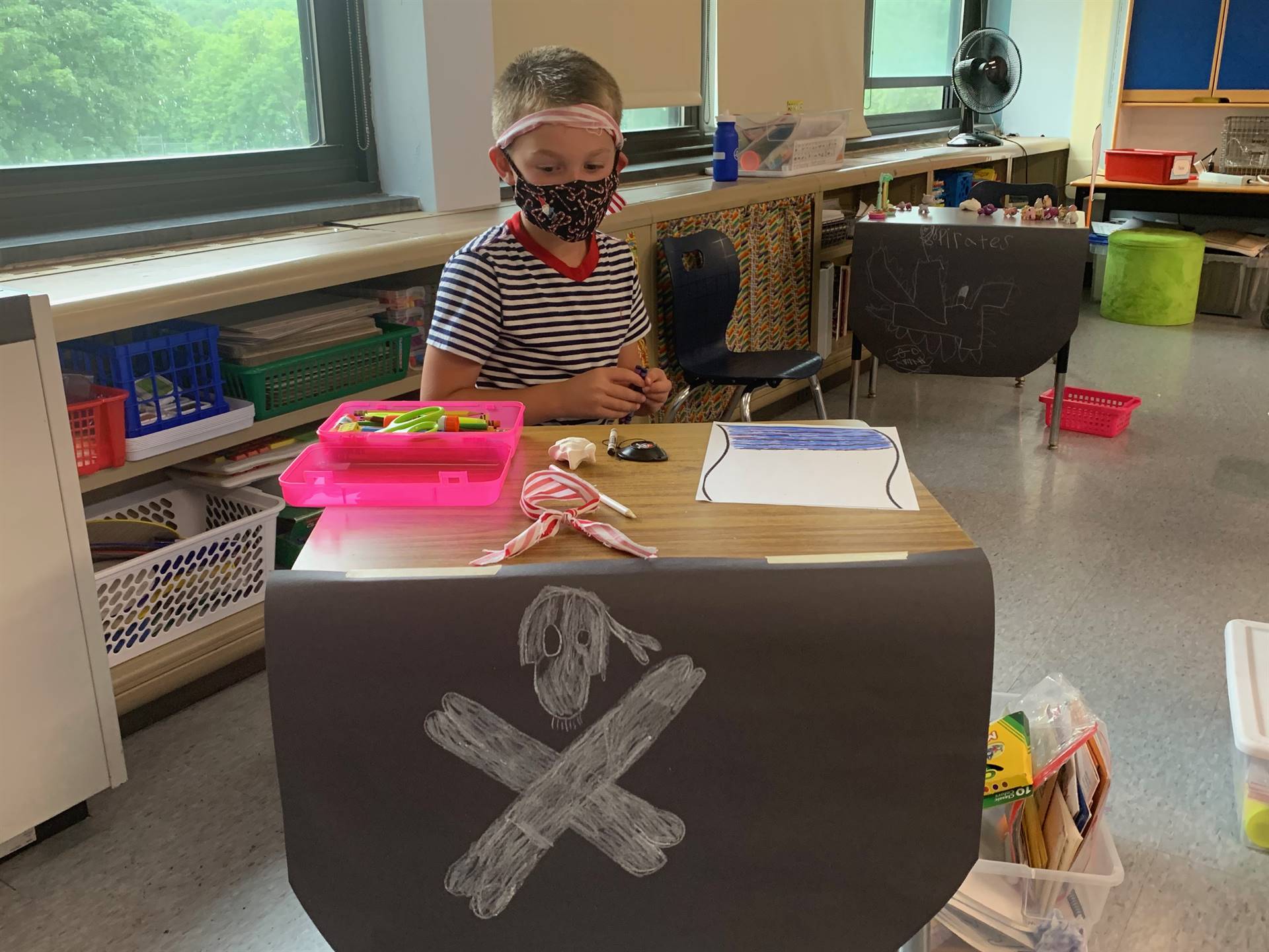 a student pirate building legoes.
