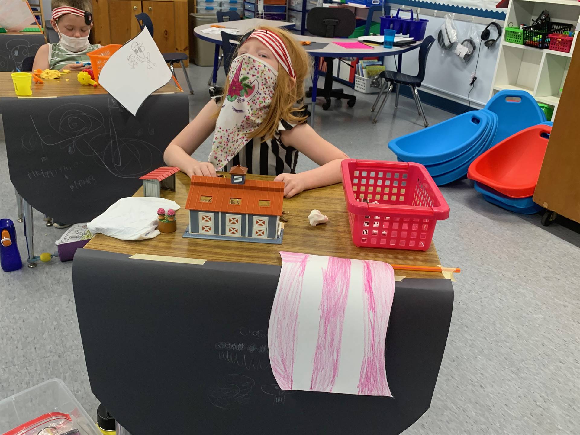 a student pirate building a house.