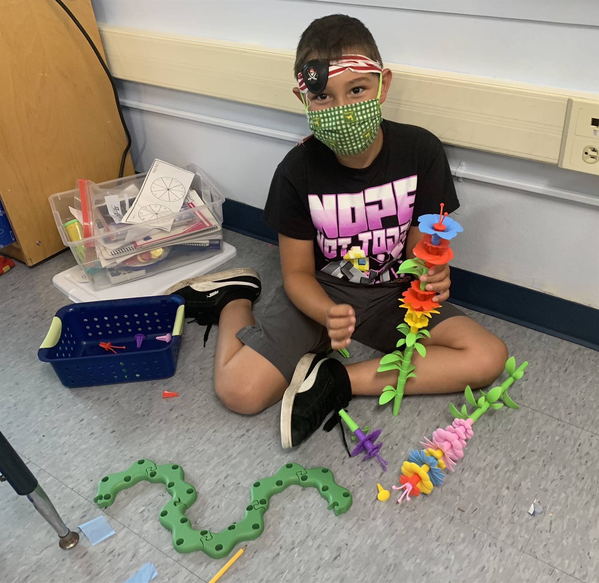  a student pirate builds with toys.
