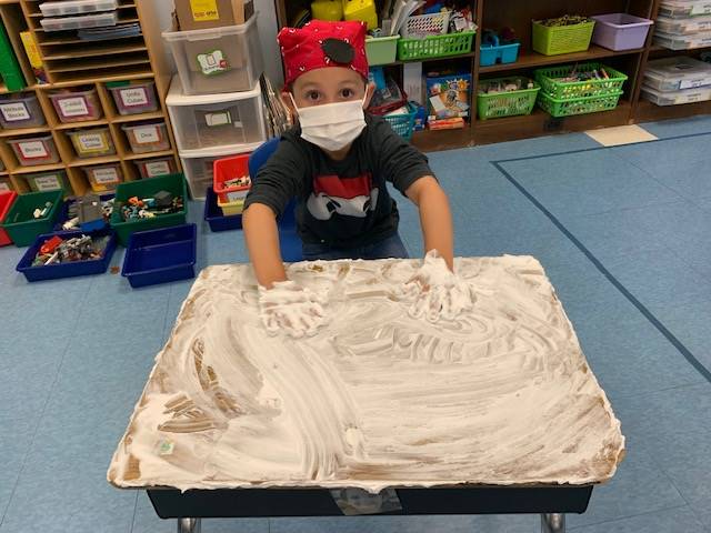 student pirate washes desk ("deck")