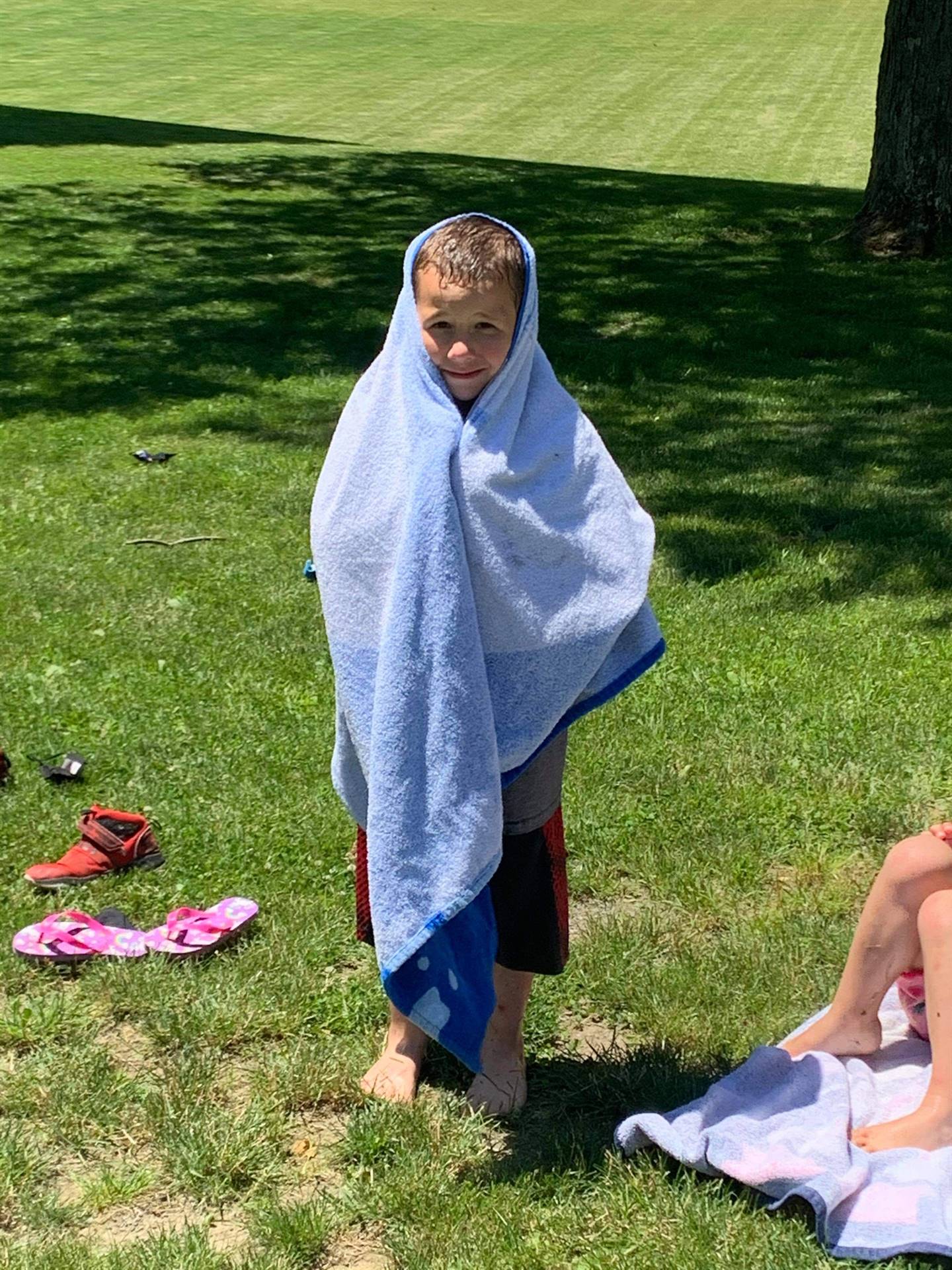 student wrapped in a towel