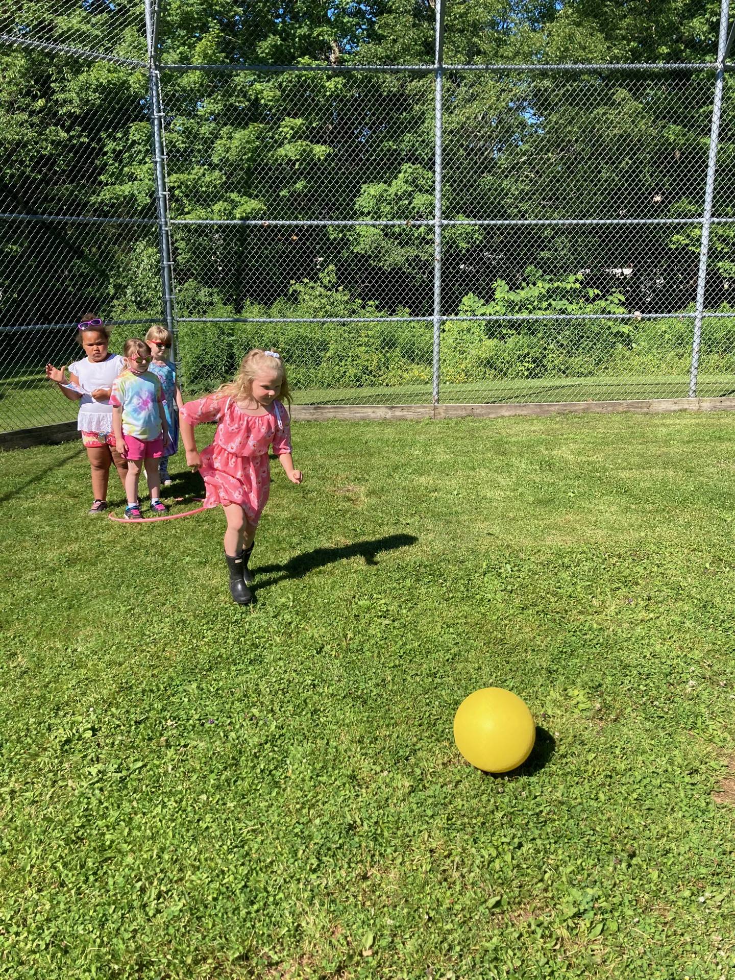 a group of students and a ball outside.