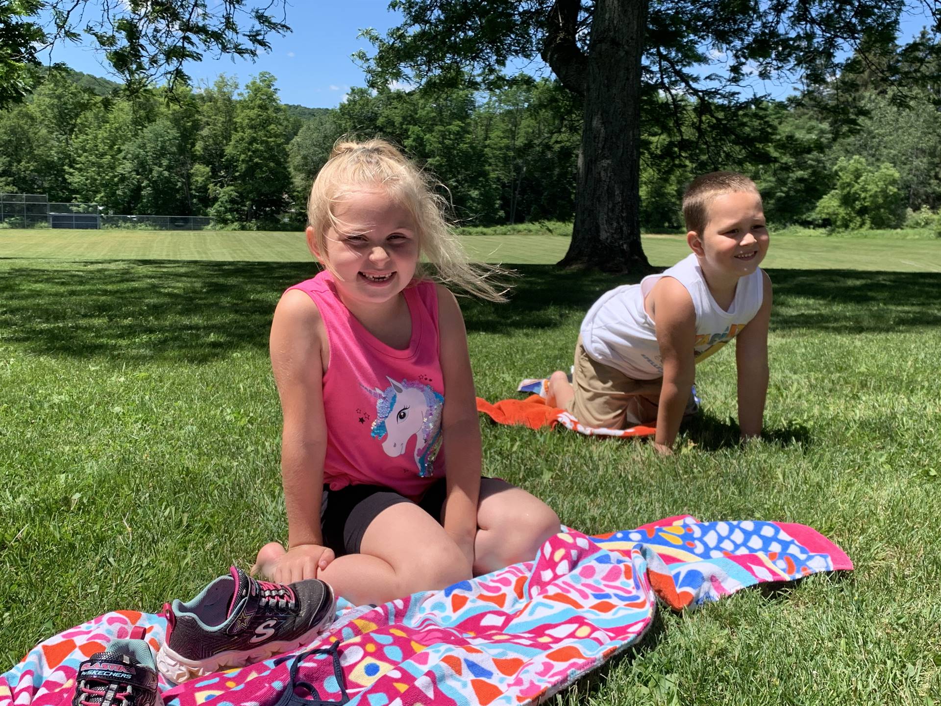 students on a beach towels