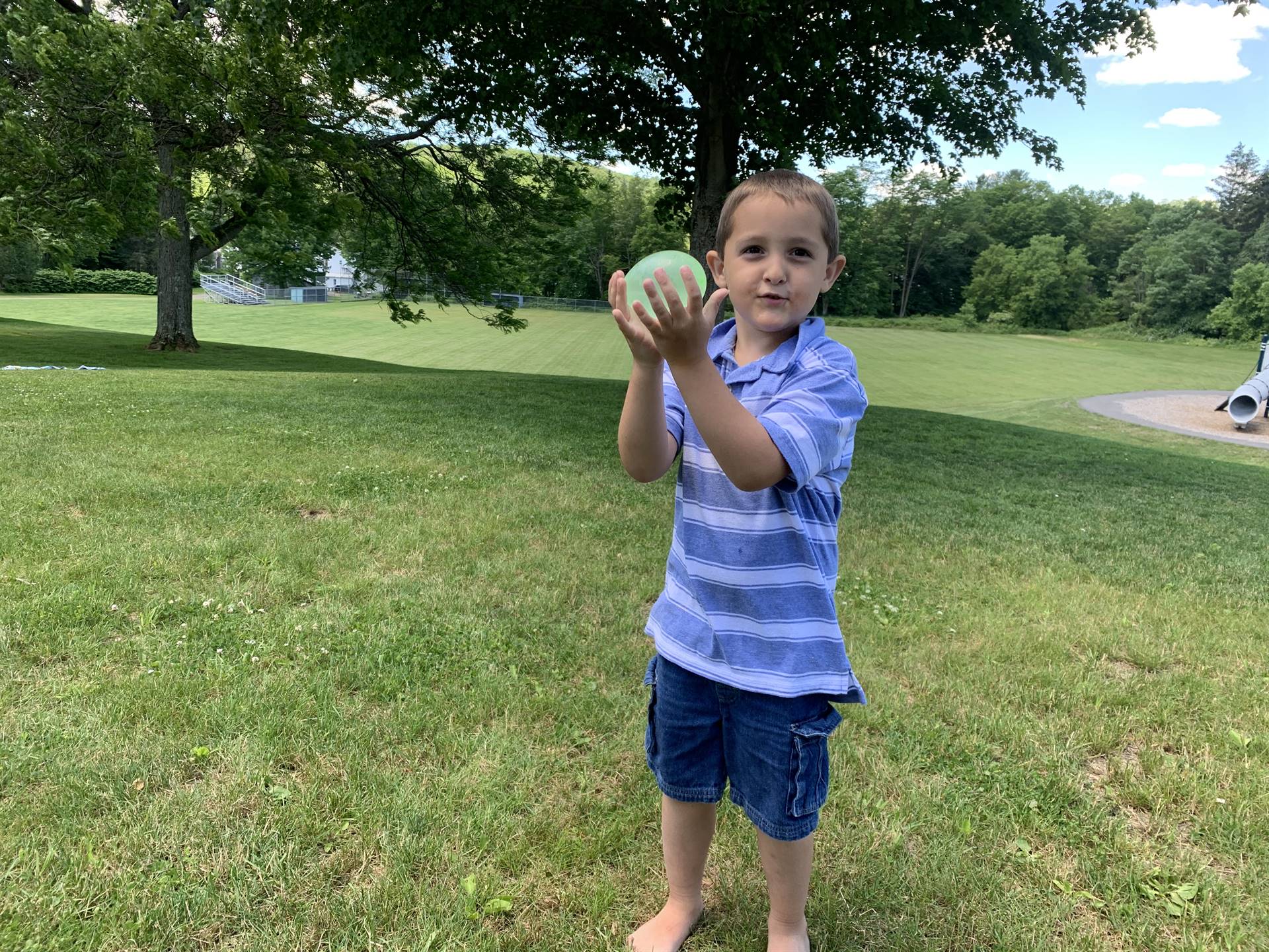 a student tosses water balloon