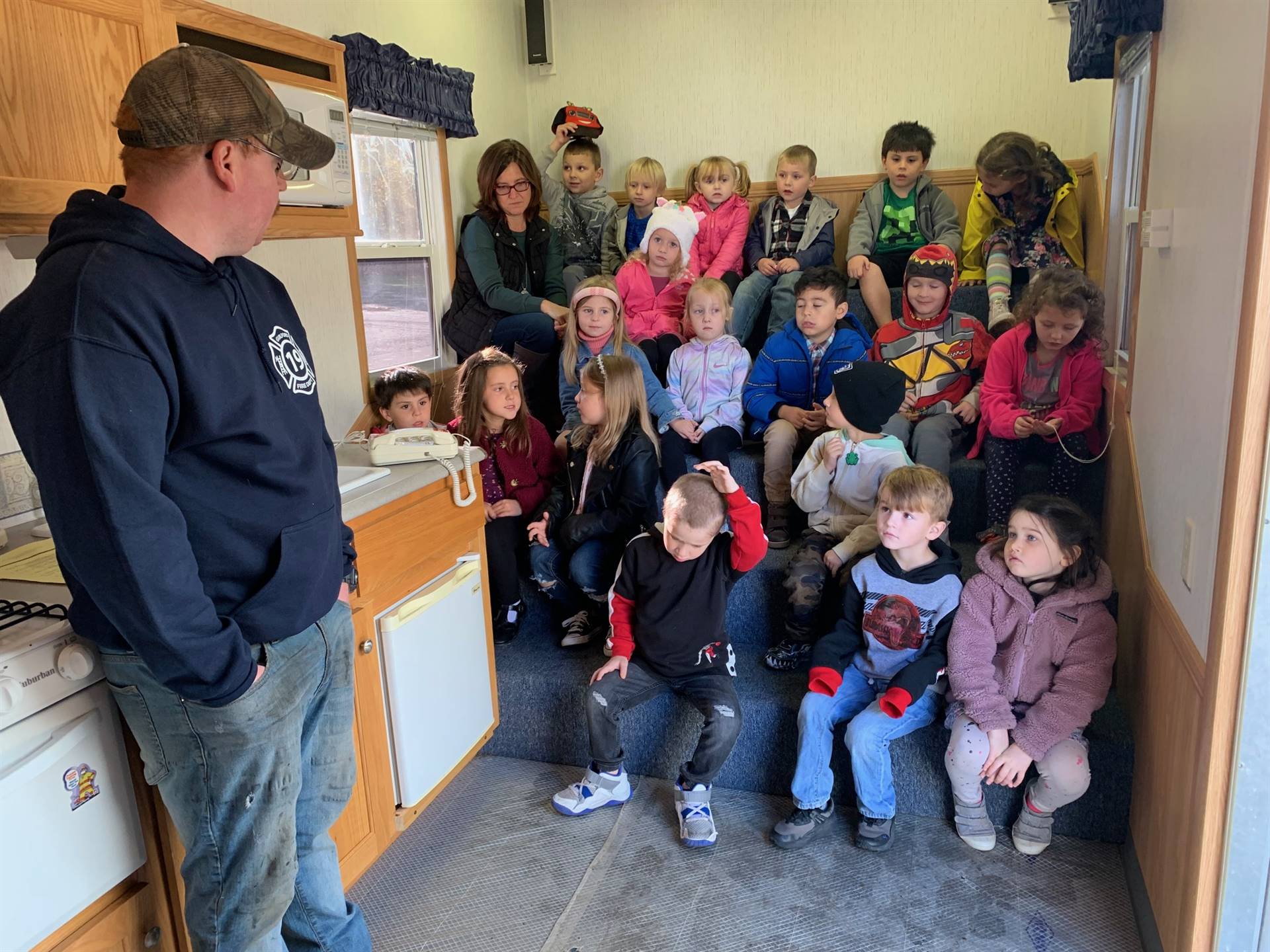 a group of students learn fire safety rules
