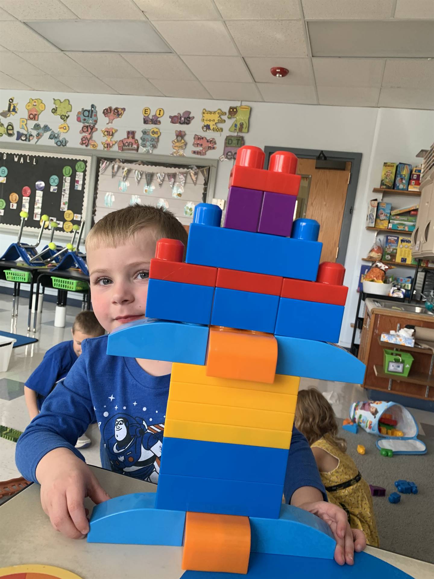 child with giant lego robot.