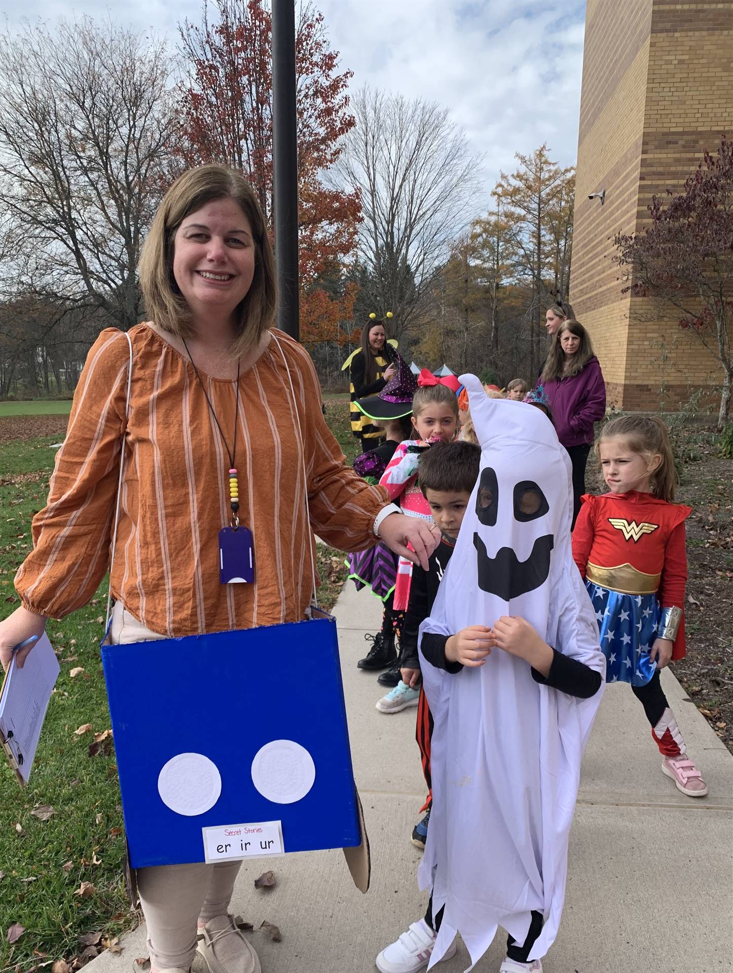 teacher dressed up as story letters and a student ghost