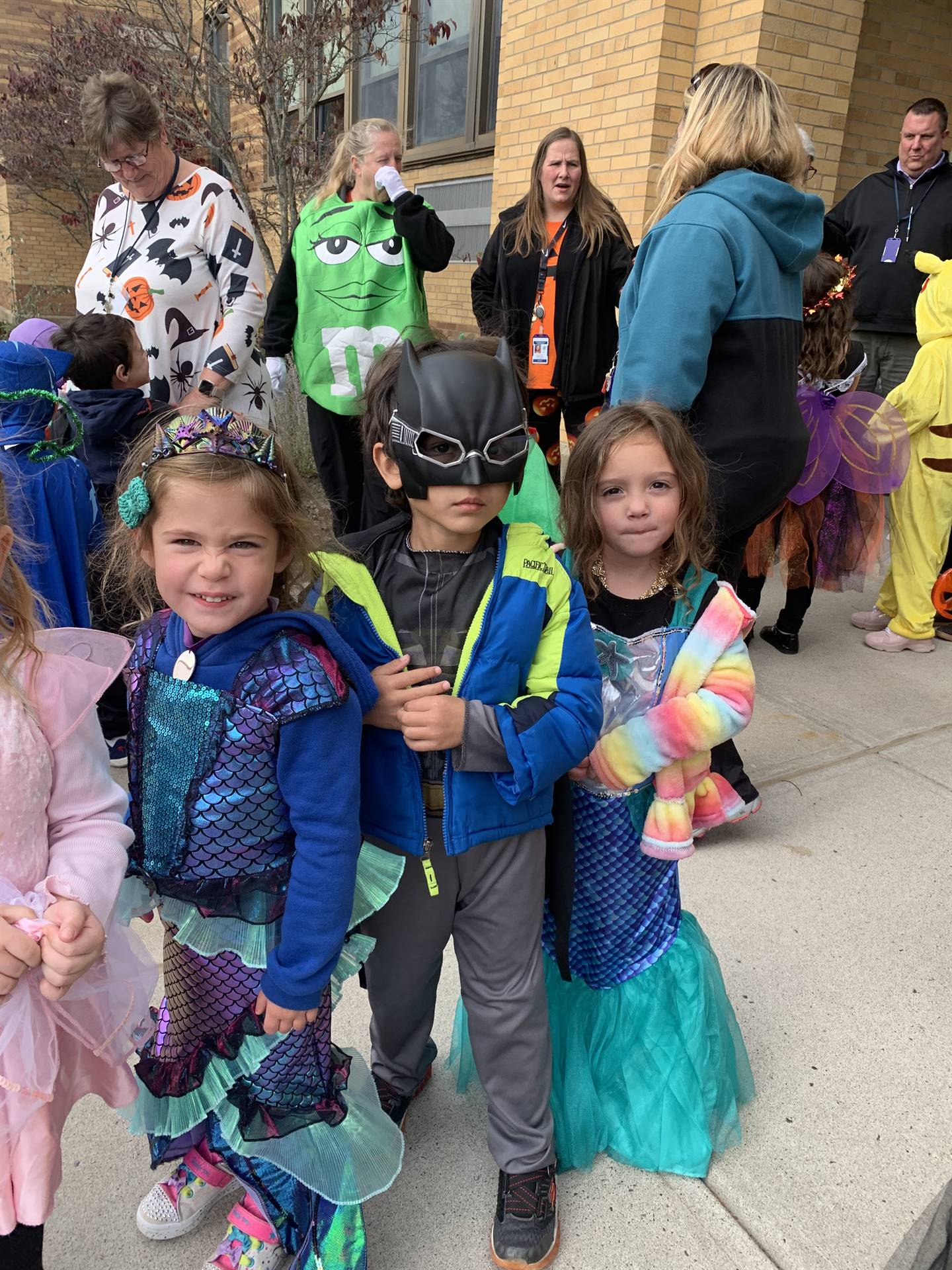a group of students in various halloween costumes