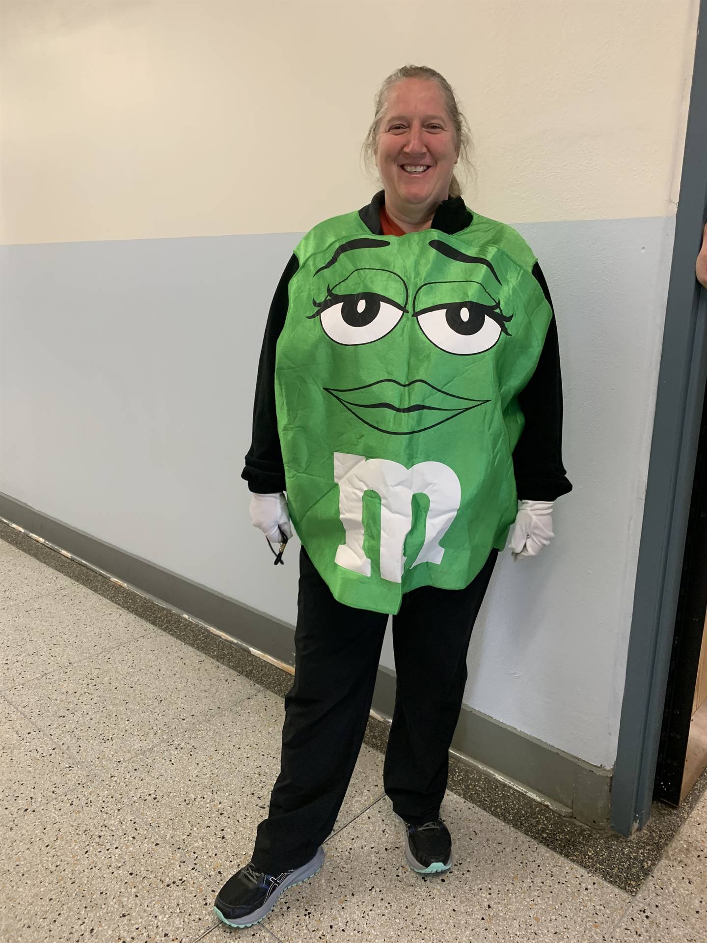 a teacher green M&M